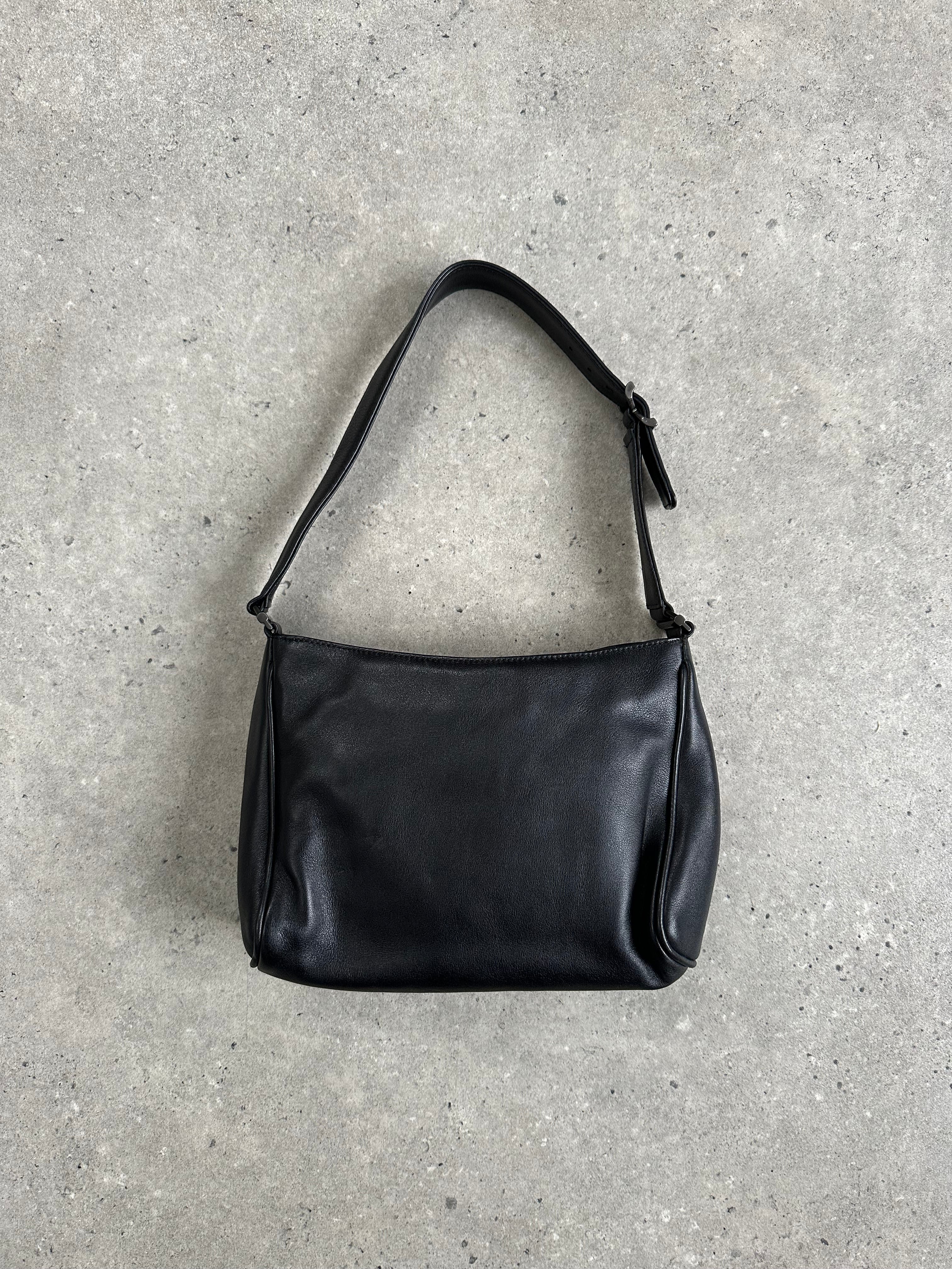 Giorgio Armani 2000s leather shoulder bag with sleek design, adjustable strap, and classic style, perfect for elegant everyday use.
