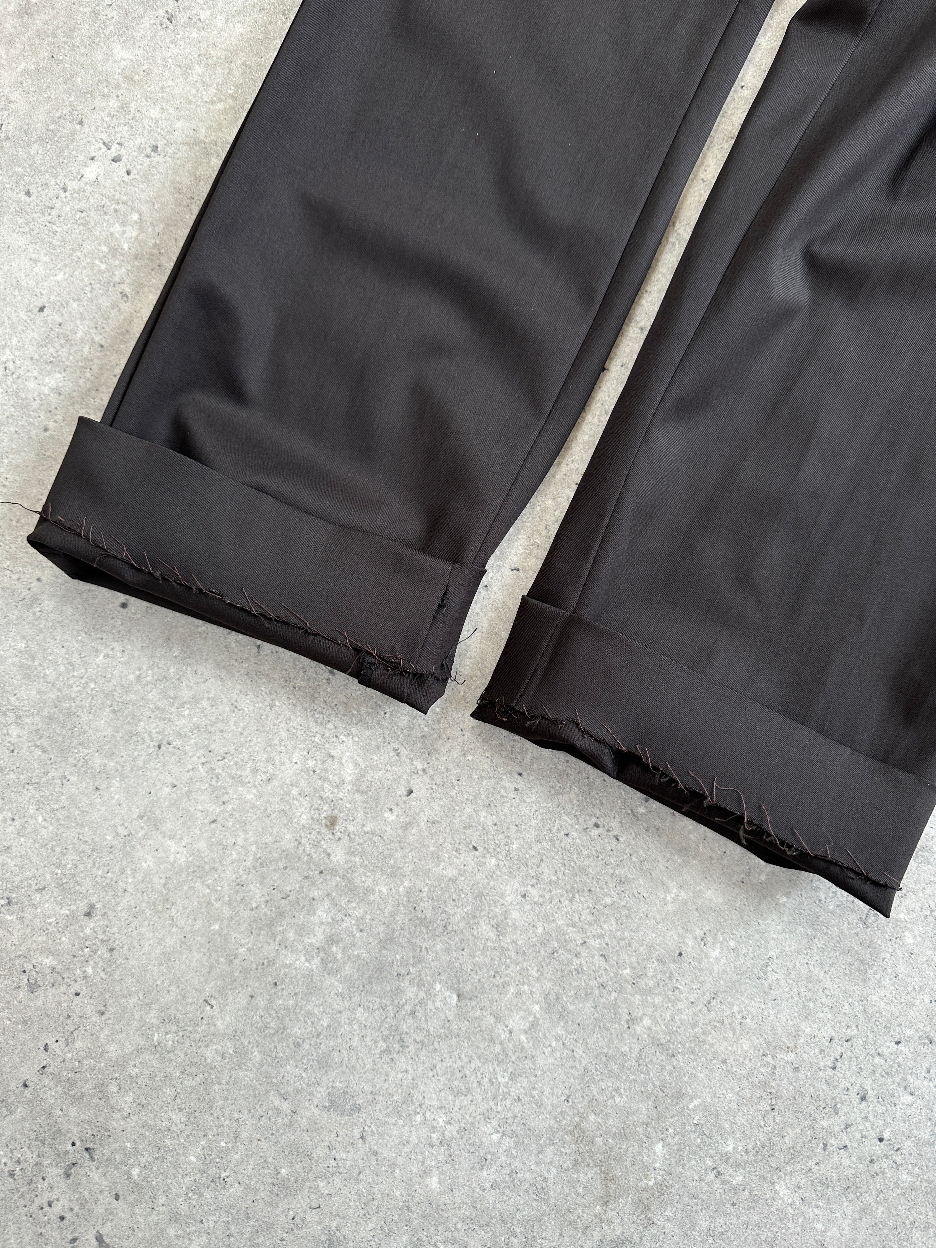 Gucci wool tailored trousers in dark color, front view showing slim fit and classic design, size W30.