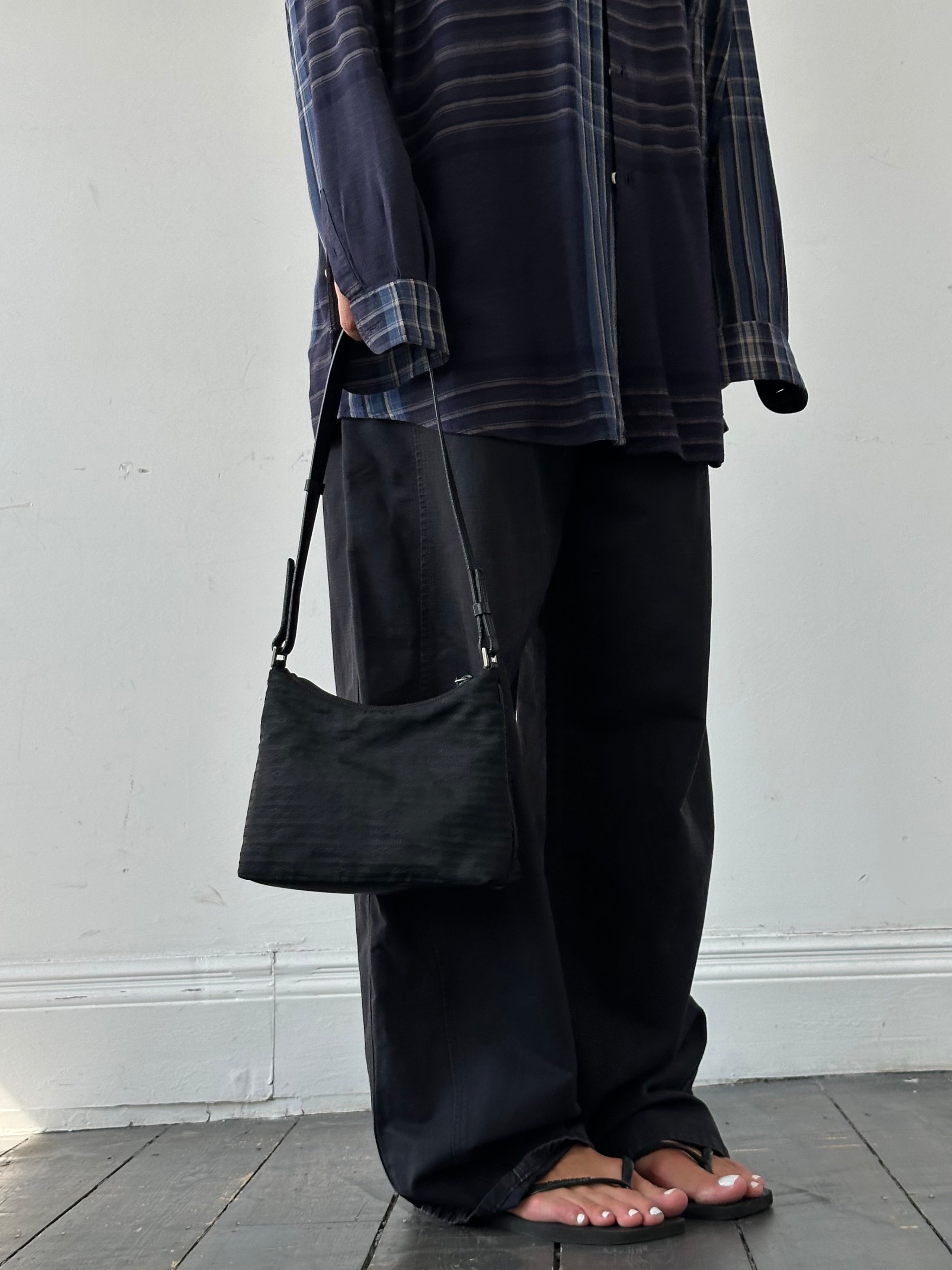 Prada Nylon Tessuto Monogram Crossbody Bag with adjustable strap and signature logo, stylish and functional accessory.