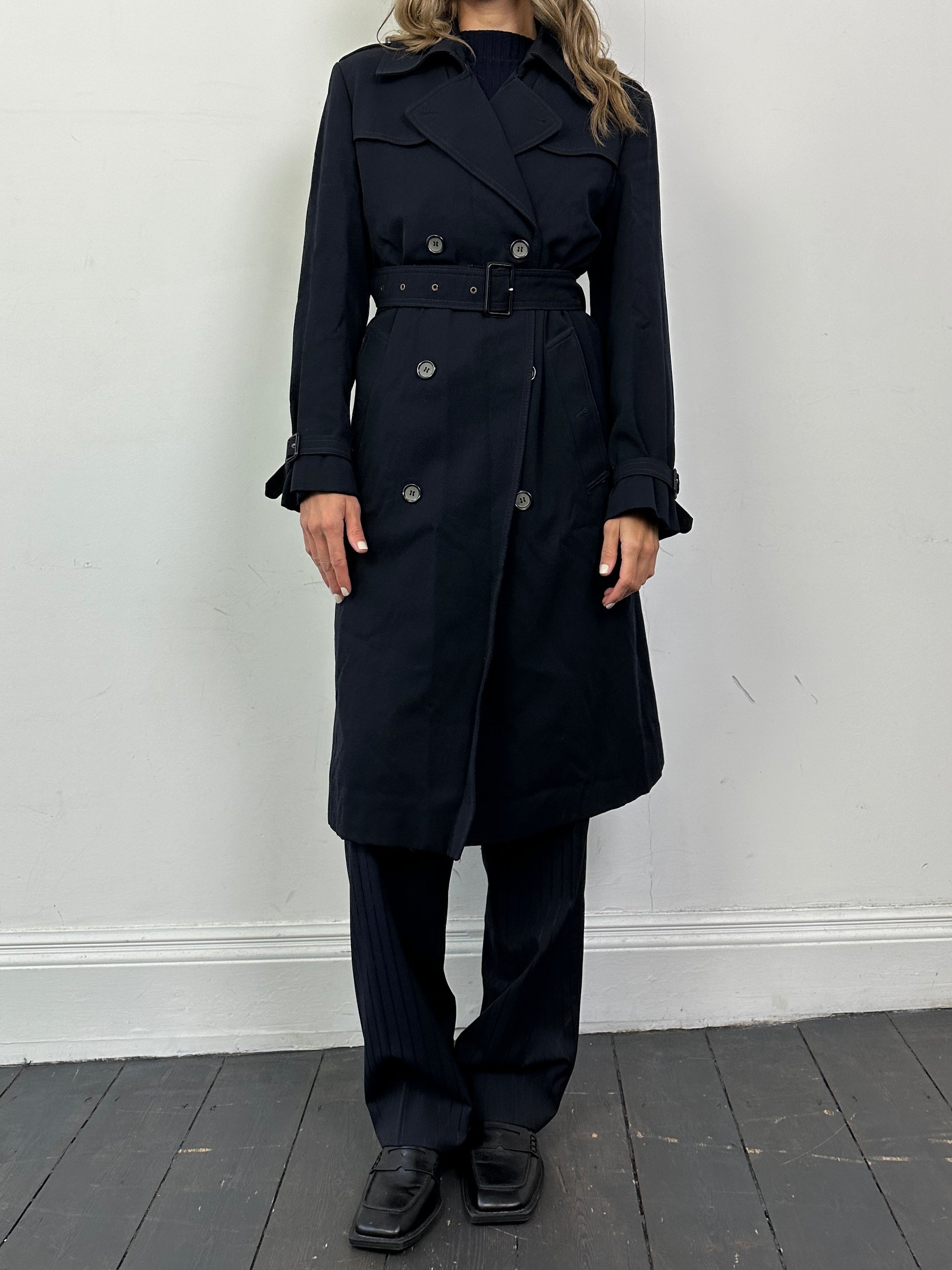 Vintage wool double-breasted belted trench coat in size small, classic style with wide lapels and button details.