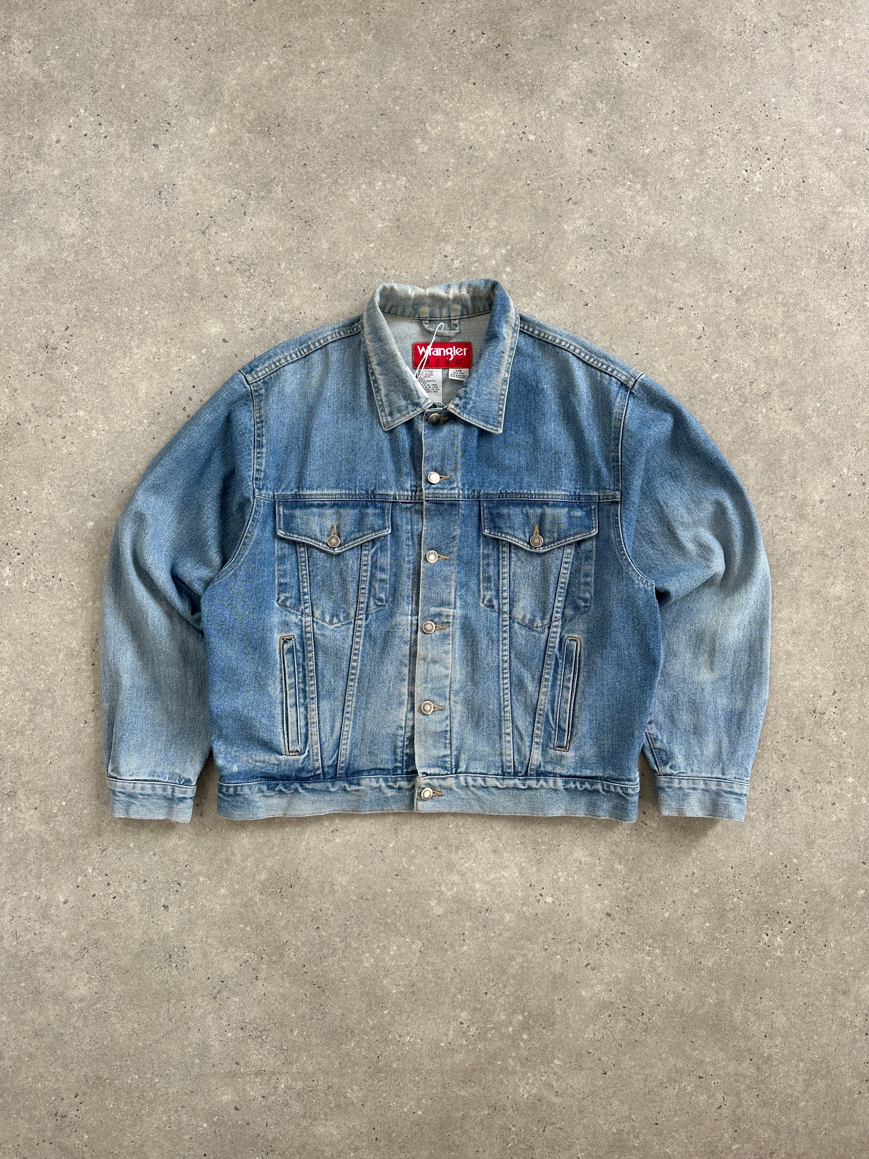 Levi’s Wrangler 1990s light wash denim jacket, L/XL, showing classic fit and faded denim fabric with button closures