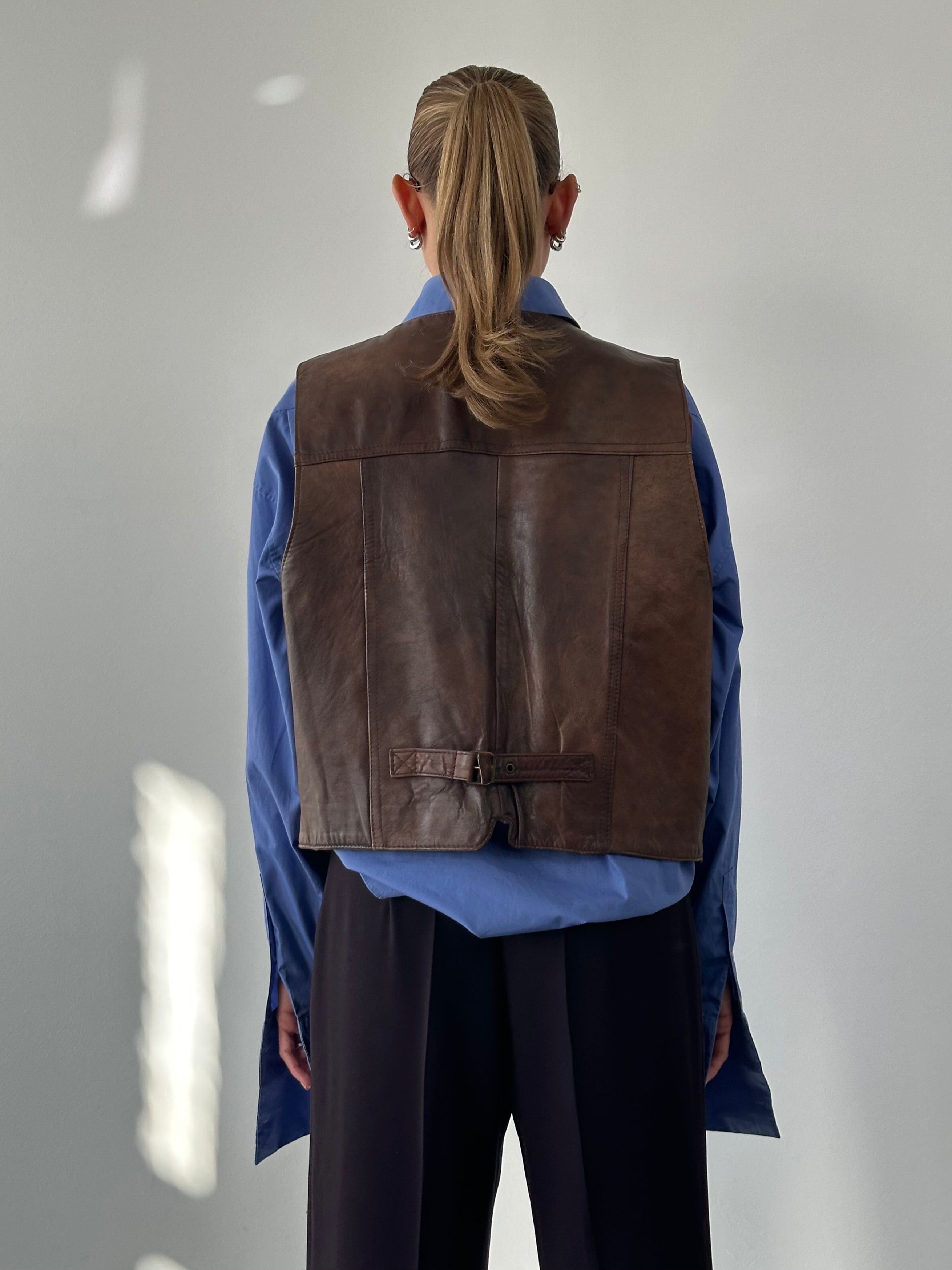 Vintage Italian aged leather waistcoat, size large, showcasing distressed leather and classic vintage design.