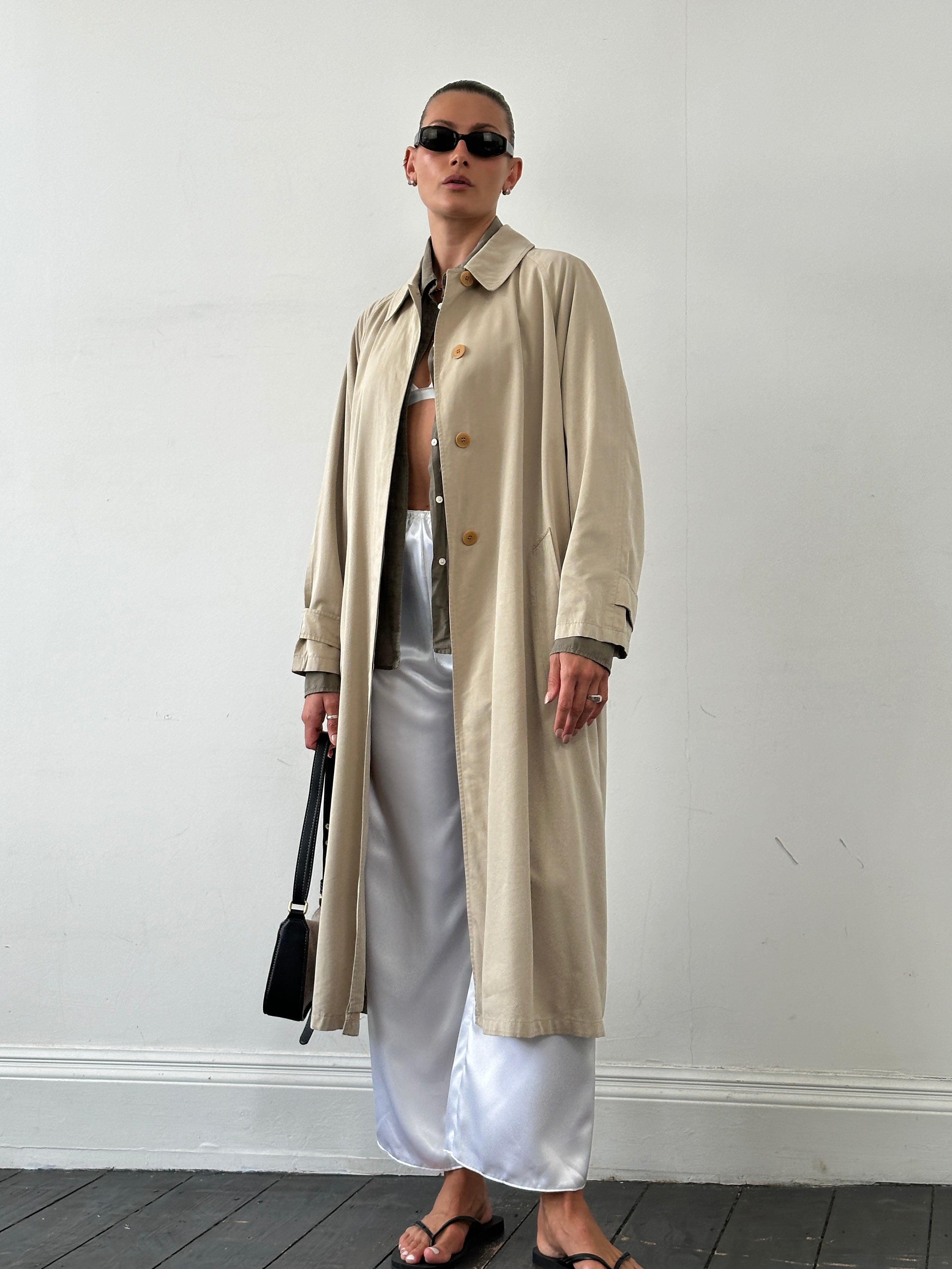 Mani Cotton Cupro Belted Trench Coat in size L/XL, beige color, with classic collar, button closure, and belted waist.