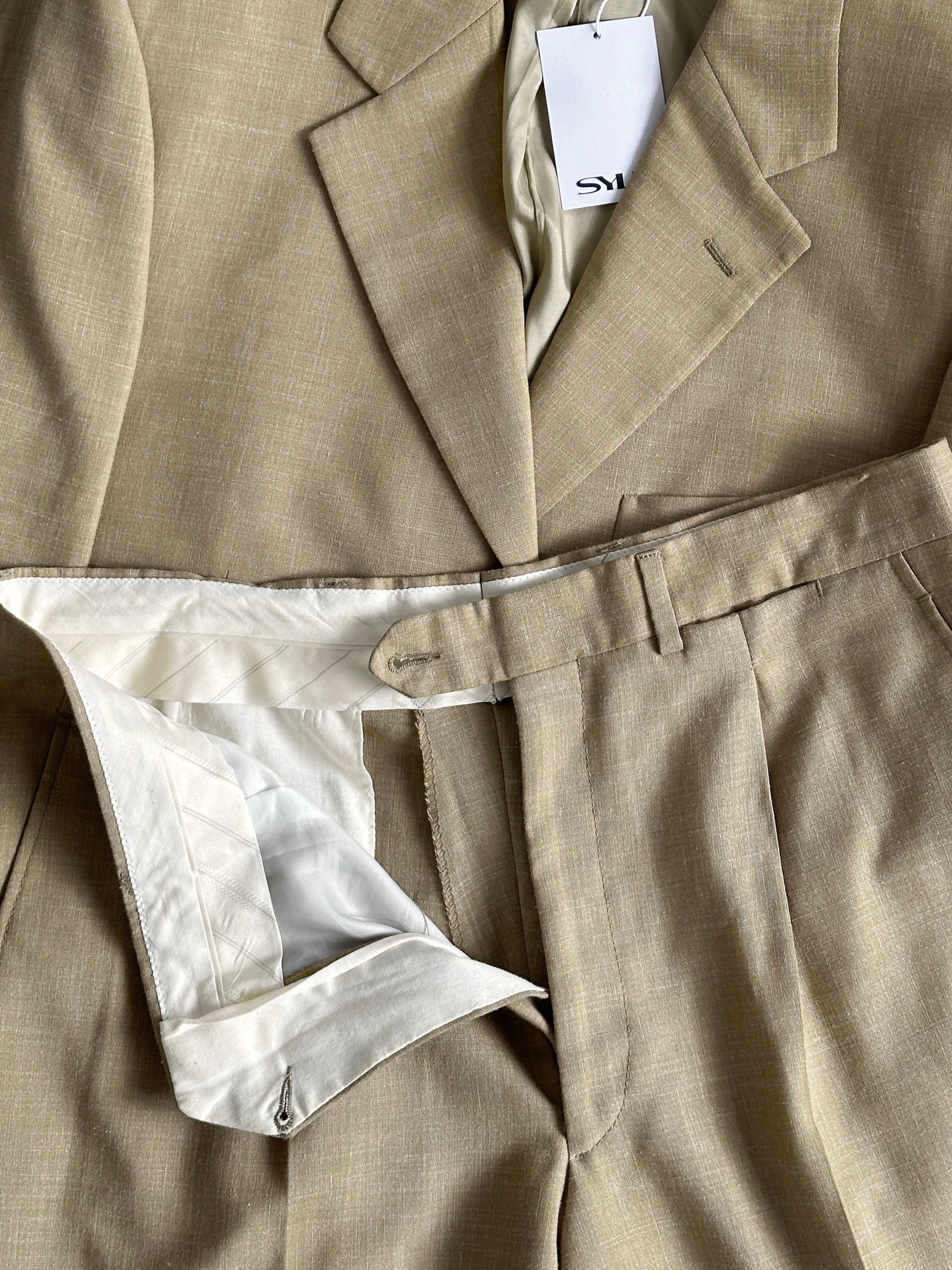 Vintage single-breasted wool linen blend jumpsuit in size 36R/W31, featuring tailored fit and classic design.