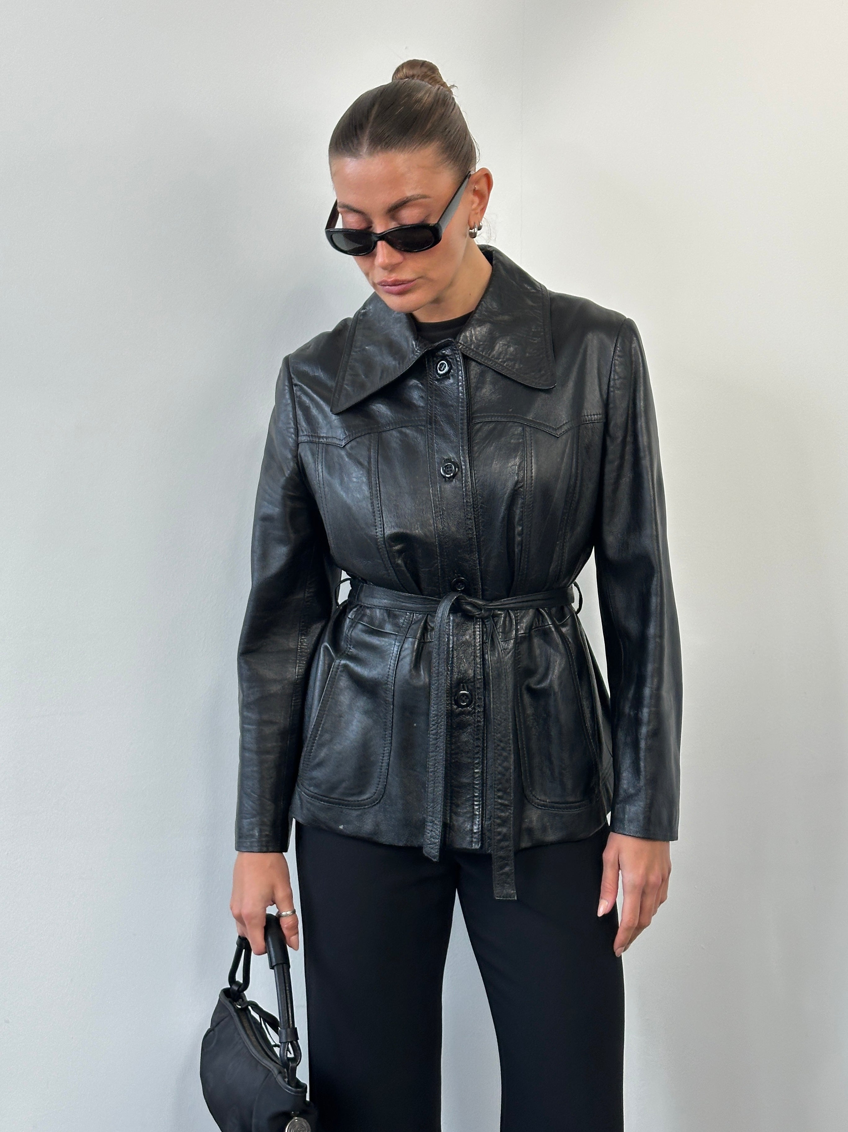 Vintage 1990s Dagger Collar leather jacket with belt, size M, featuring classic distressed leather and stylish design.