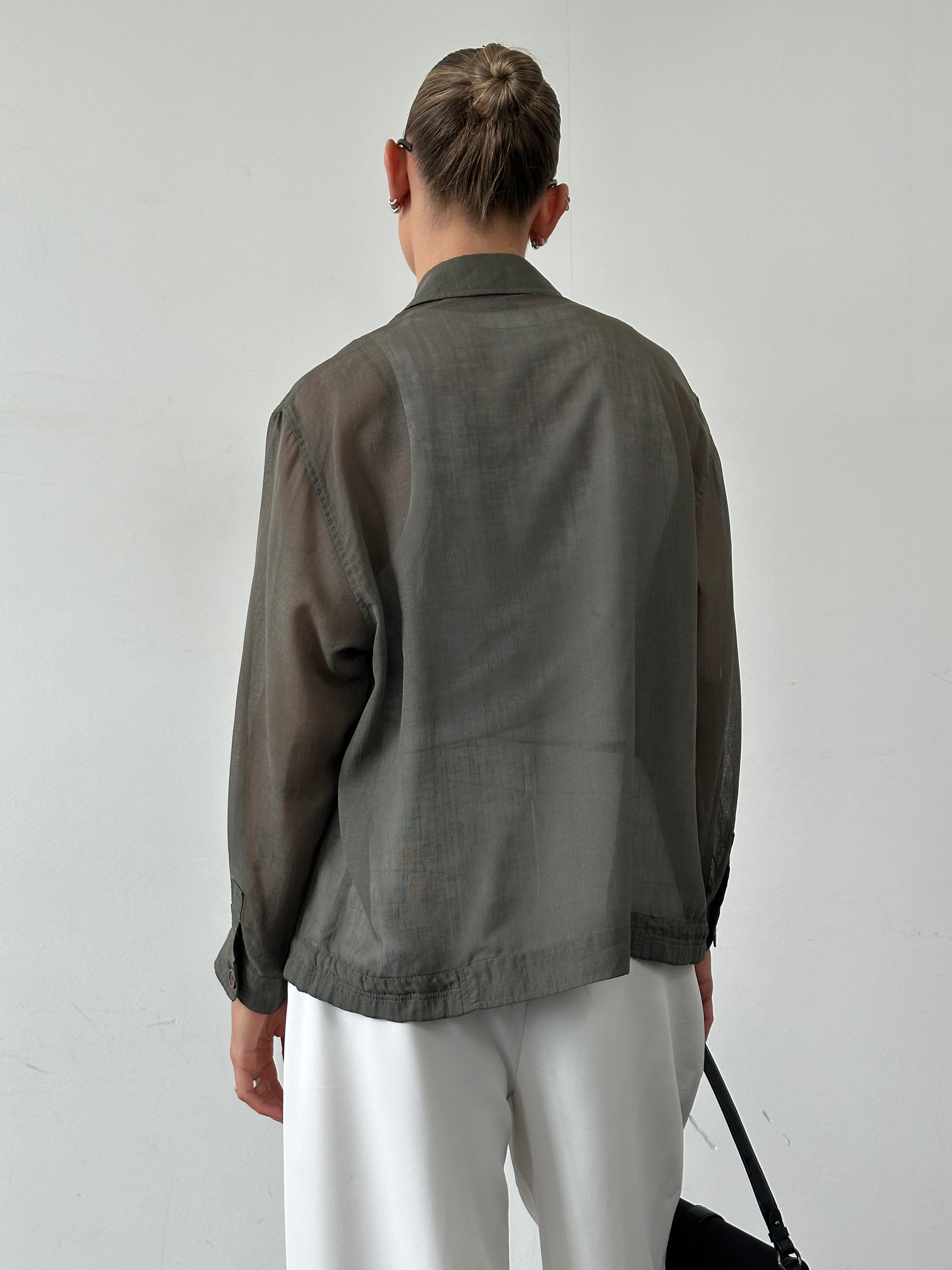Yves Saint Laurent Pour Homme logo sheer bomber jacket in black, lightweight fabric with front zipper and logo detail.