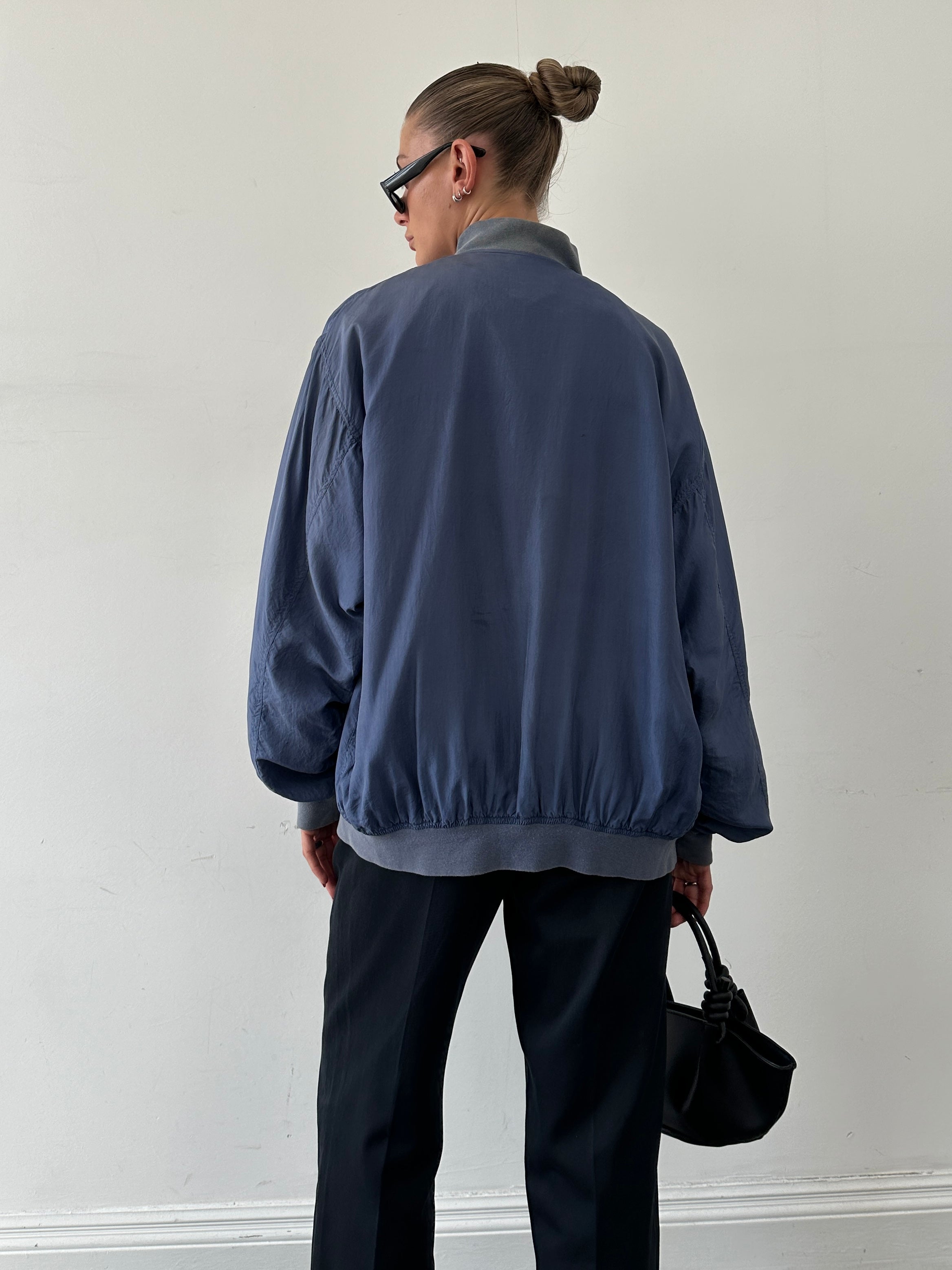Vintage pure silk bomber jacket in XL, featuring a classic design with smooth fabric and ribbed cuffs and collar.