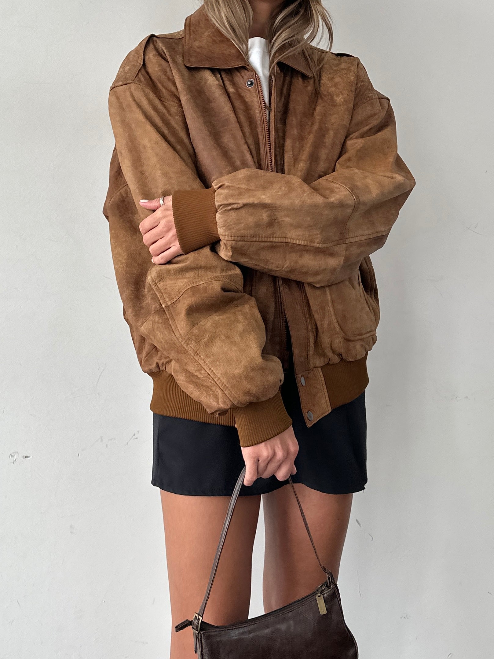 Vintage aged leather bomber jacket in XL, featuring classic design, distressed finish, and sturdy construction.