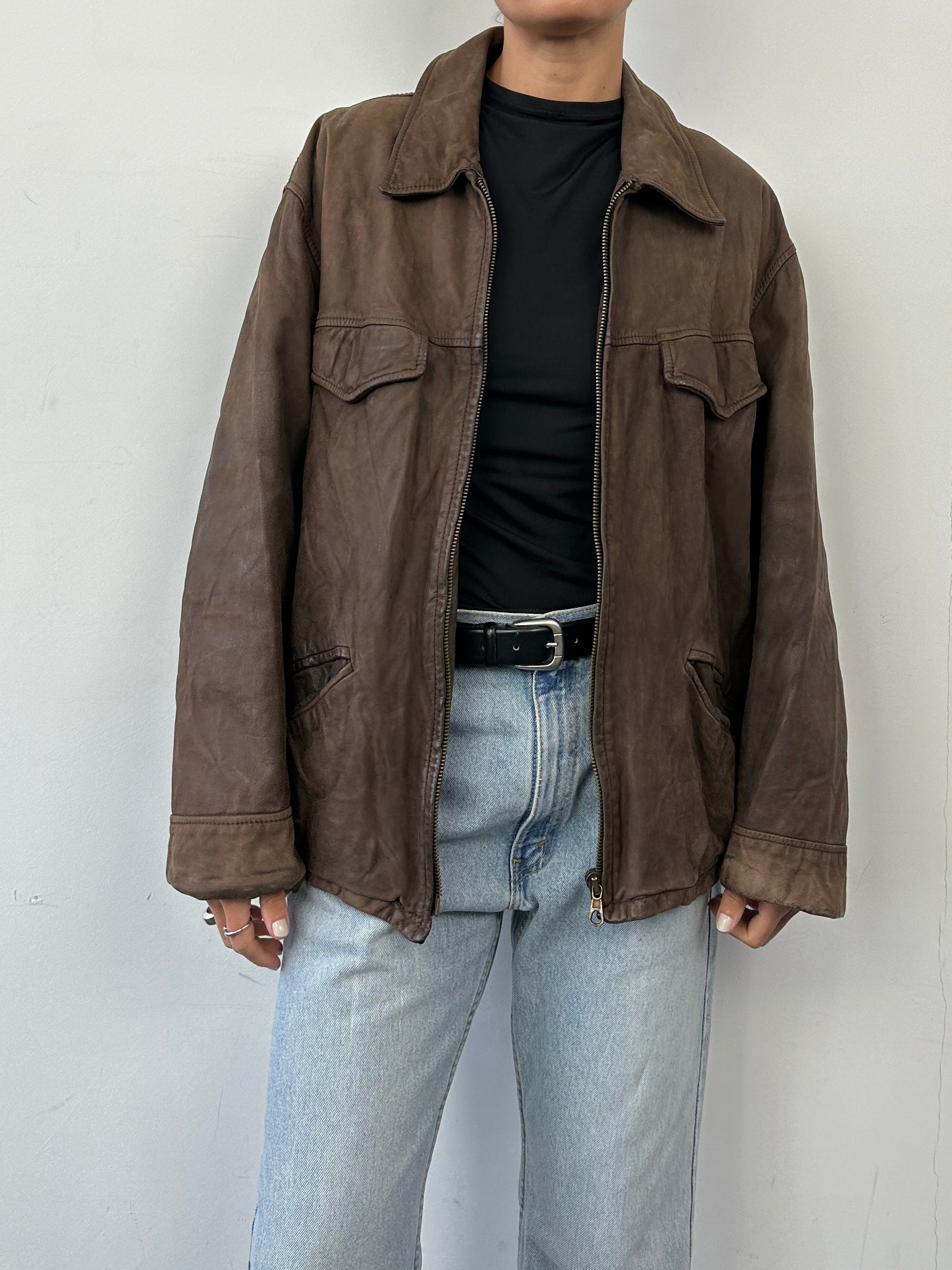 Vintage Italian vintage nubuck leather zip-up jacket in size L, featuring classic design and textured leather surface.