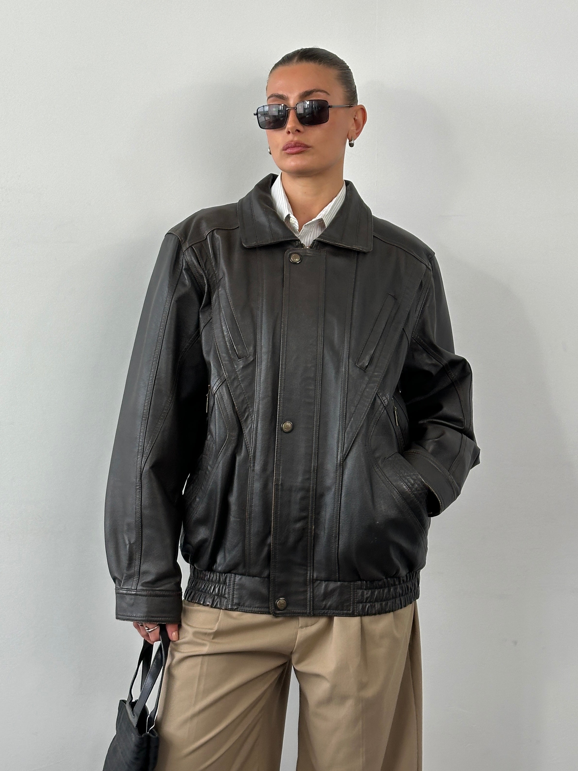 Vintage leather blouson bomber jacket in XL, featuring classic design, ribbed cuffs, and front zip closure.