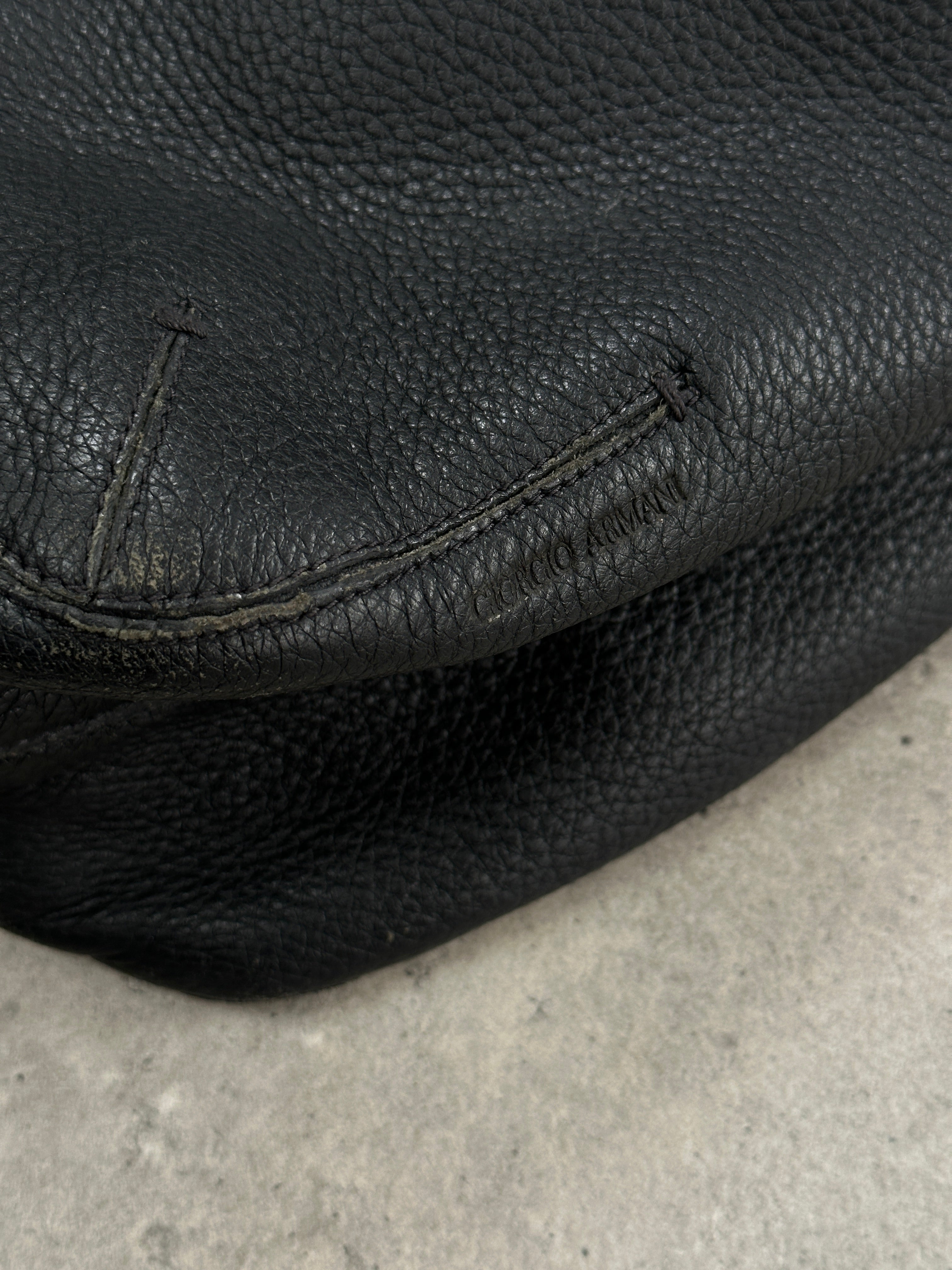 Giorgio Armani leather hobo shoulder bag from the 2000s with a slouchy design and shoulder strap, in classic brown leather.