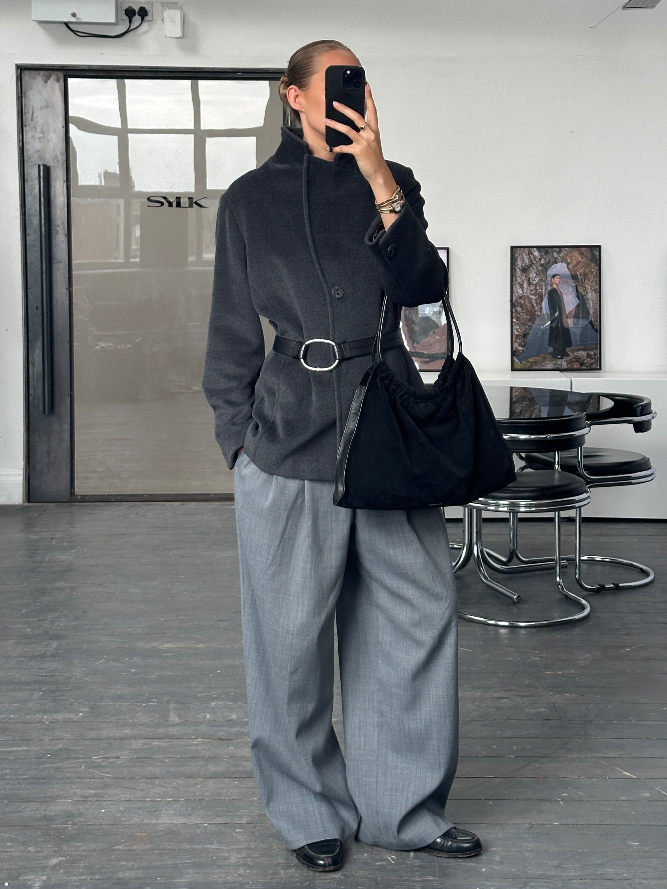 Krizia 1990s Virgin Wool Coat, medium size, stylish jacket with classic design and textured fabric, suitable for cold weather.
