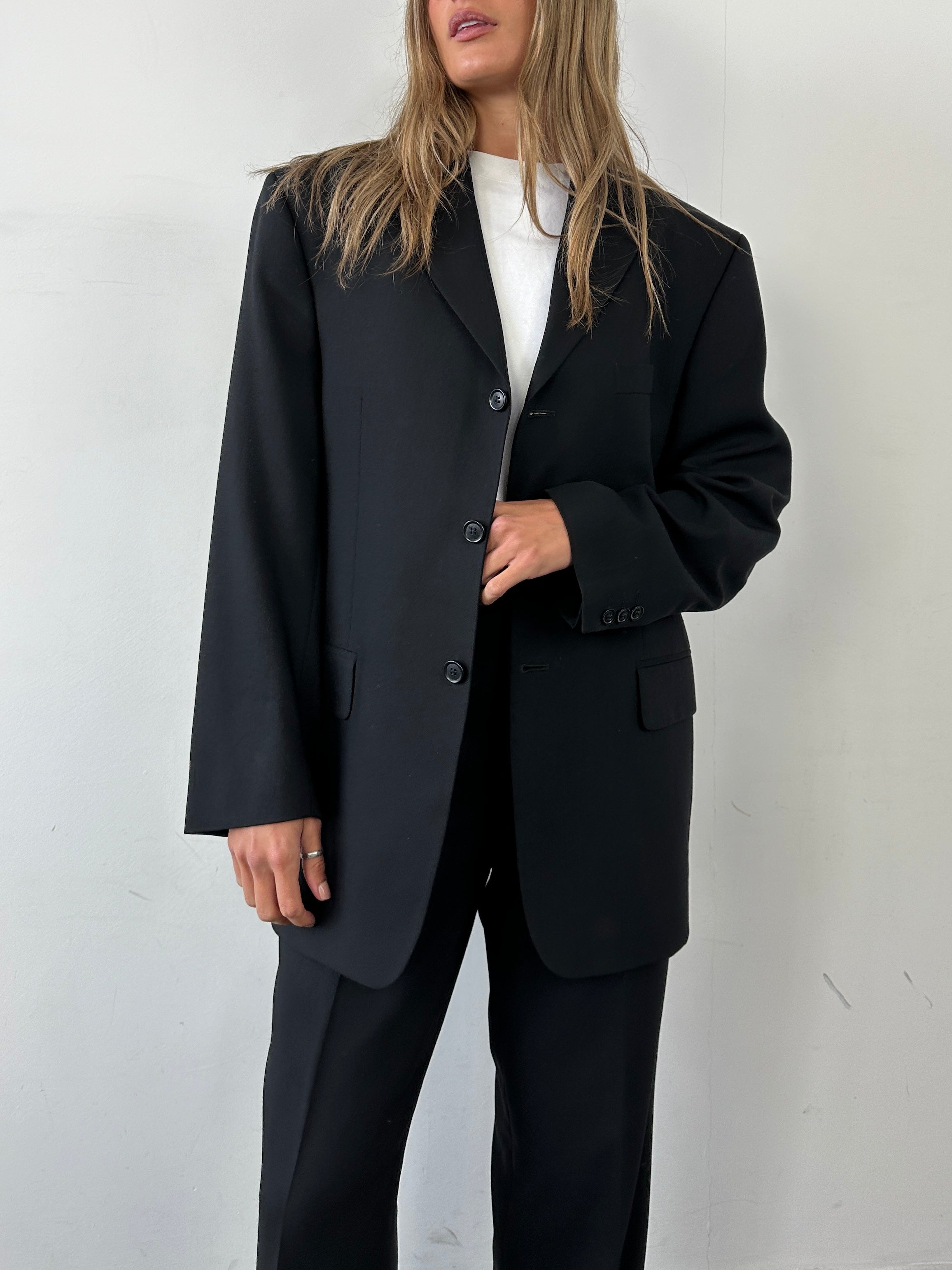 Pierre Cardin pure wool single-breasted jumpsuit in size 40R/W34, tailored with a classic fit and sleek design.