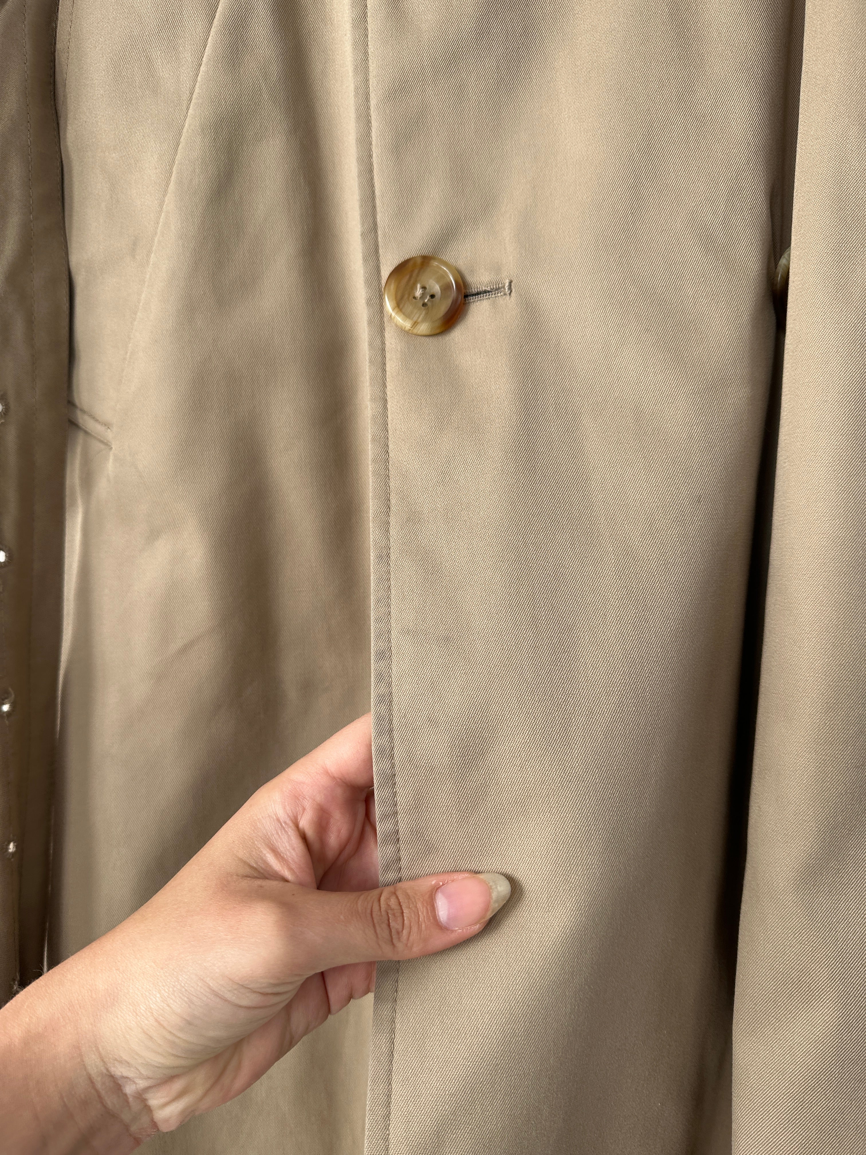 Aquascutum cotton double-breasted belted trench coat in size XL, featuring classic design and neutral color, displayed on a hanger.