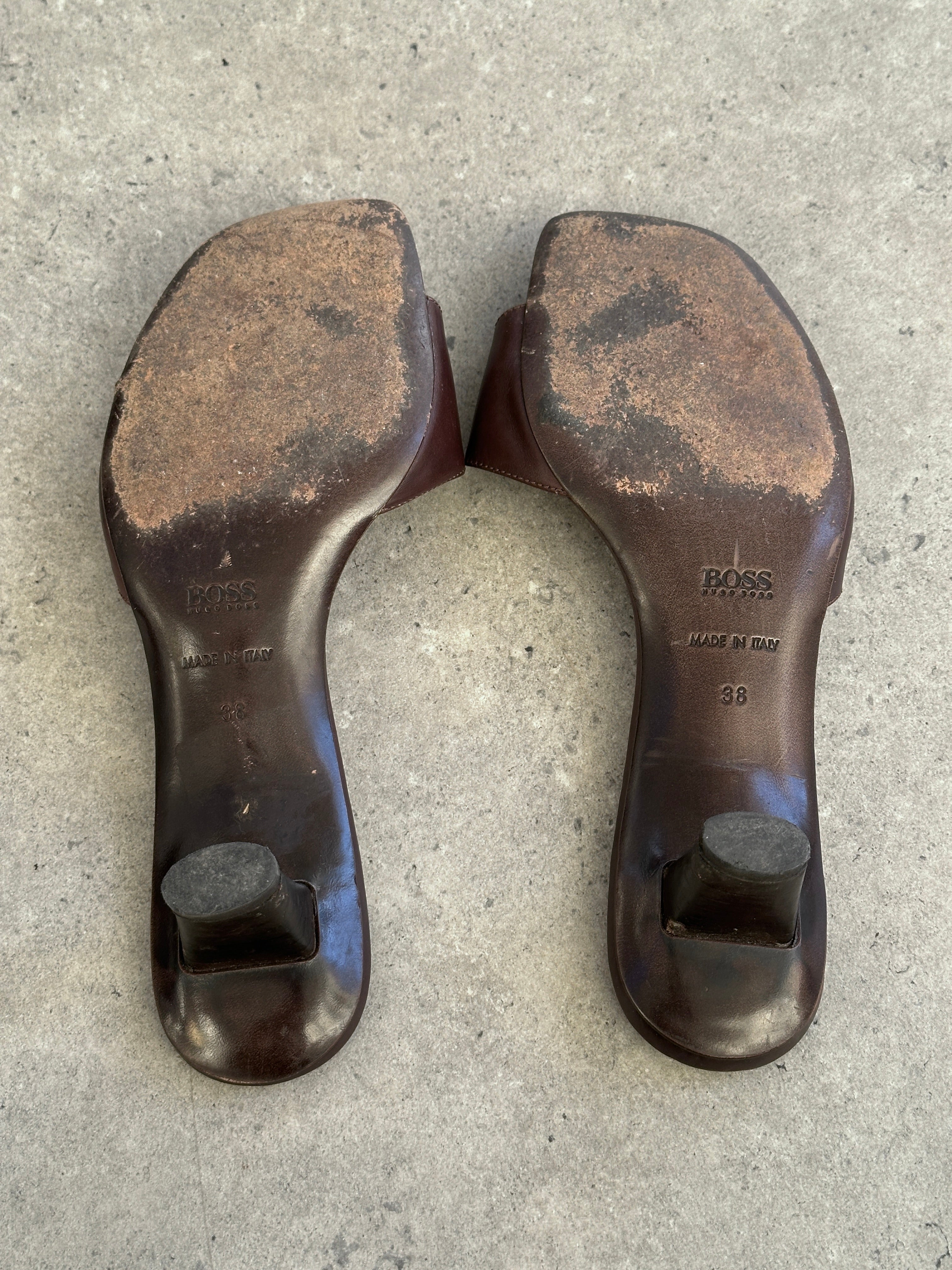 Hugo Boss leather mules in black, UK size 5, EUR 38, showcasing sleek design and smooth leather material.