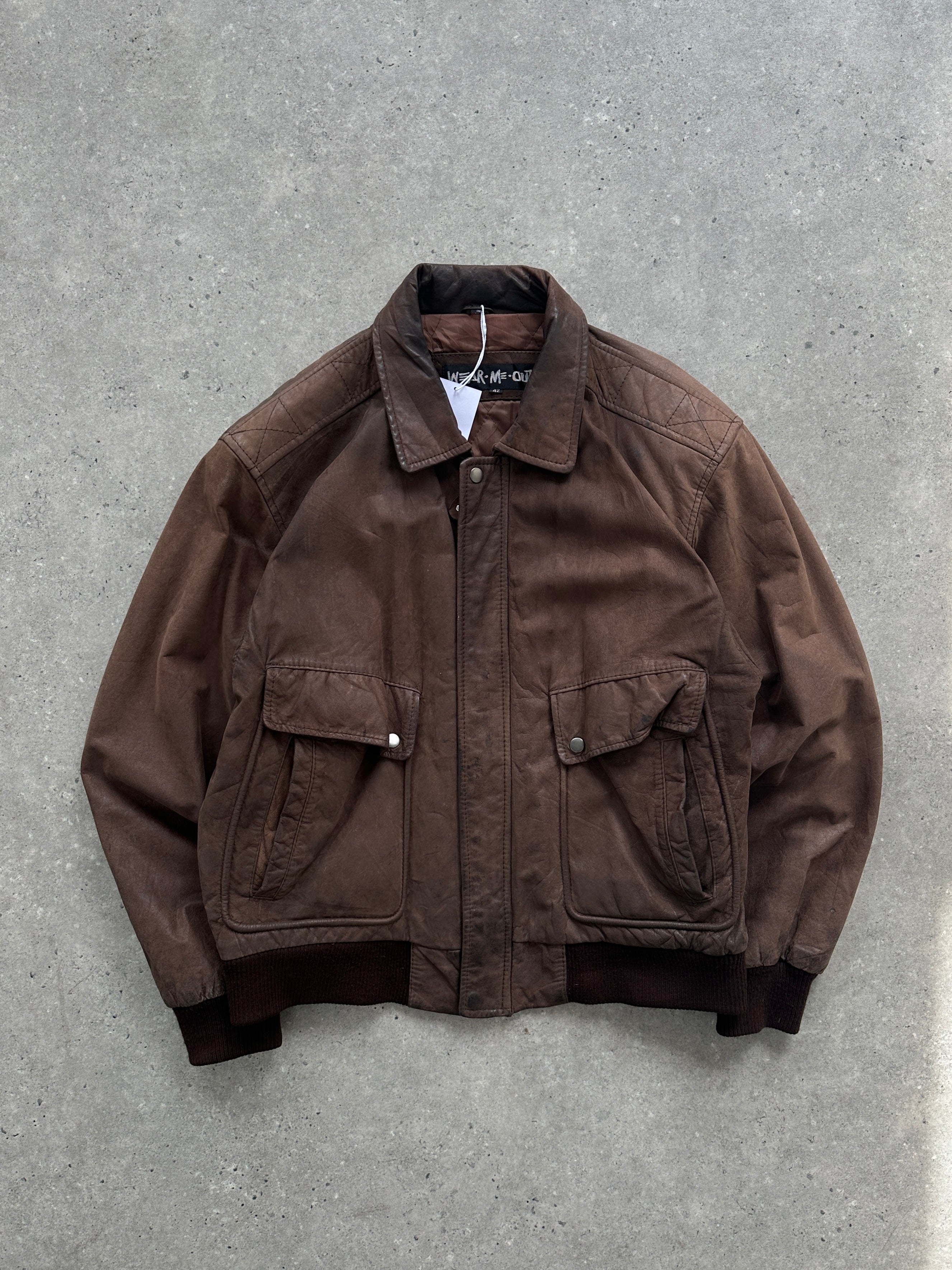 Vintage distressed leather bomber jacket, size large, featuring a rugged style and classic design.