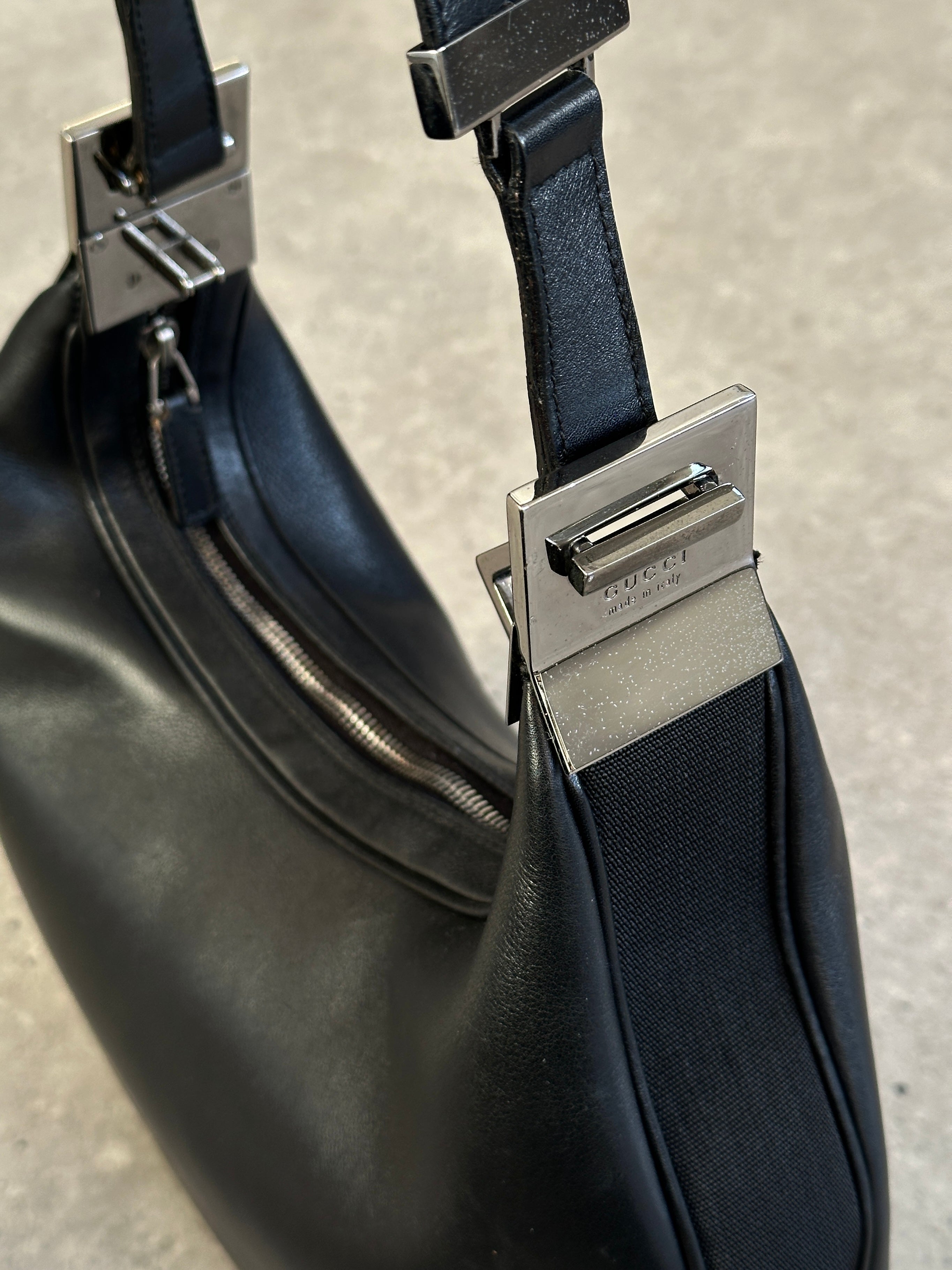 Gucci 1990s Tom Ford GG 3-in-1 leather attache bag with multiple compartments and classic design, featuring Gucci branding.