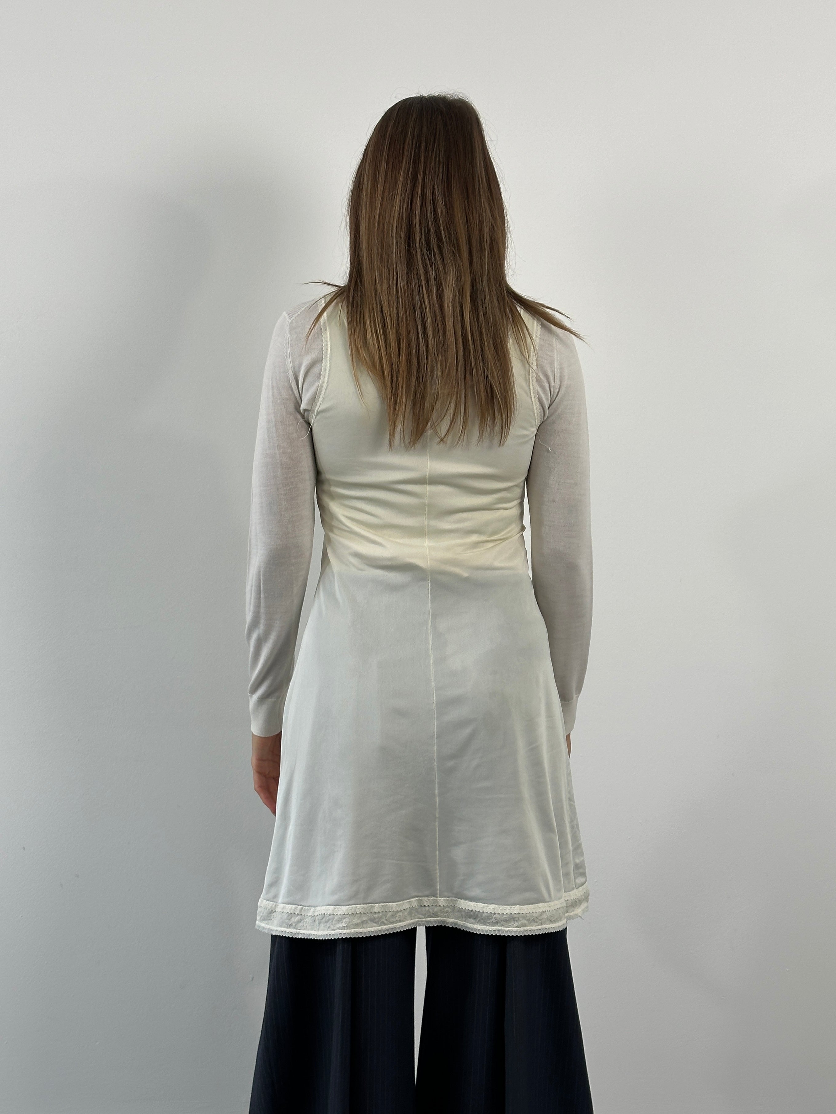 Vintage 1990s lace mini slip dress, size small, featuring delicate lace fabric and retro styling.