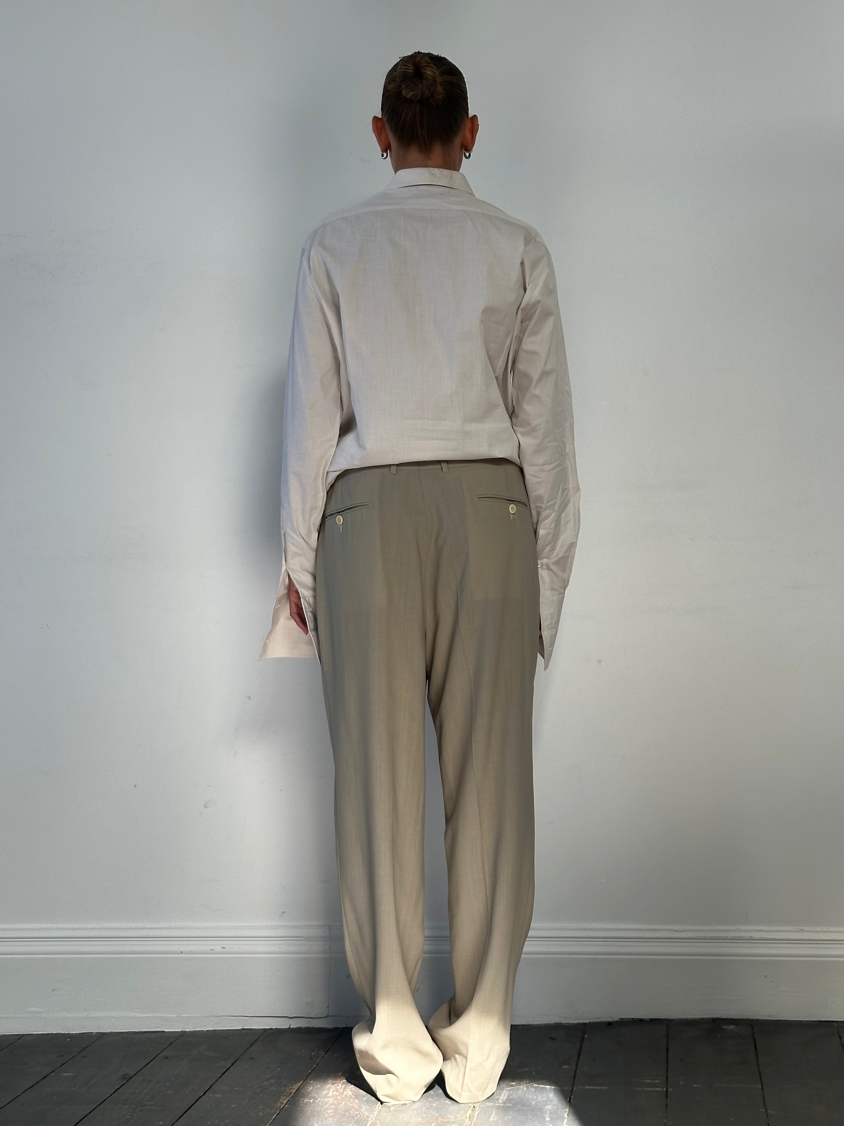 Vintage wool high-waisted straight-leg trousers with belt loops and front pockets, styled in a classic vintage fashion.