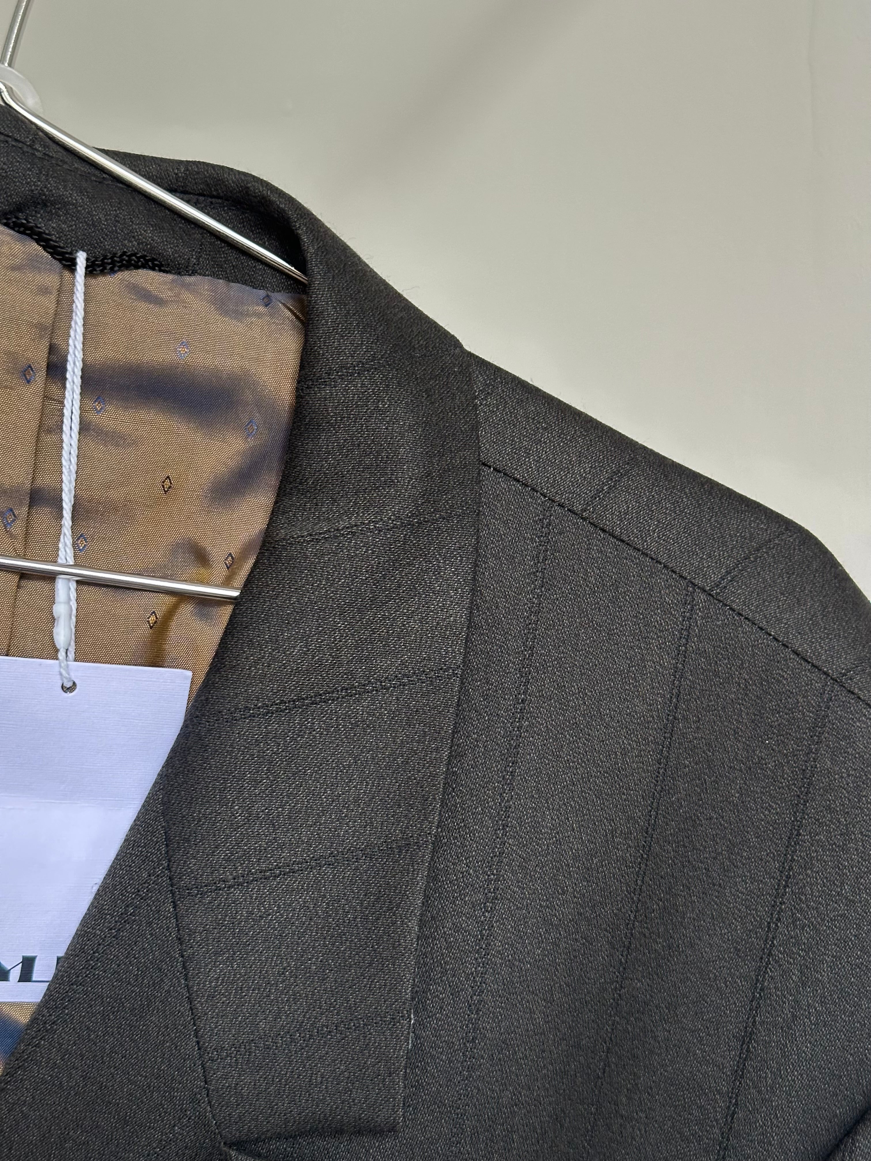 Vintage wool pinstripe double-breasted suit in size 44R/W34, featuring classic tailored fit and timeless style.