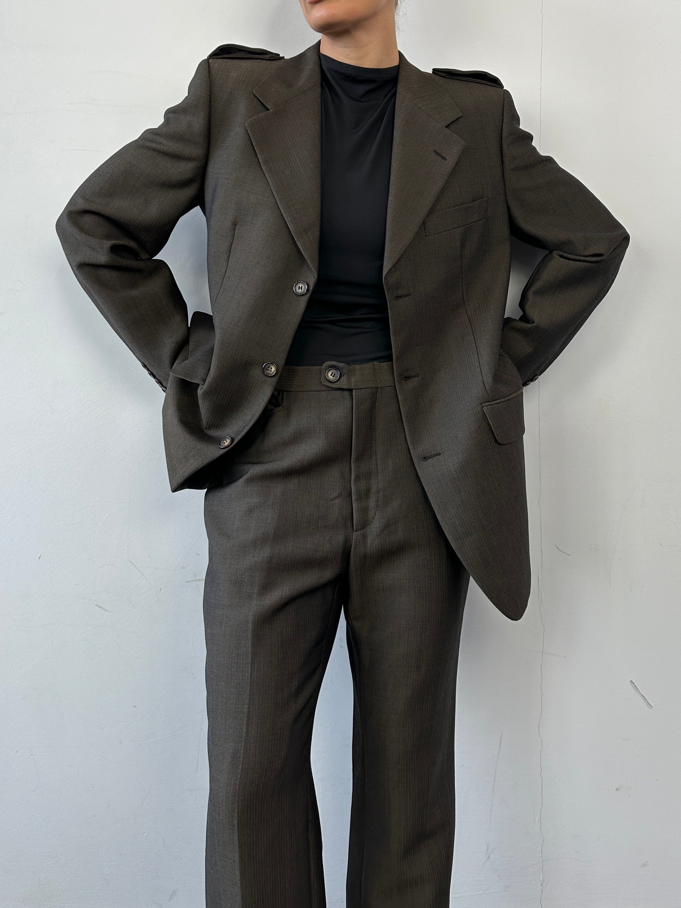 Gucci wool mohair single-breasted jumpsuit in size 40L/W30, featuring tailored fit and elegant design, shown on model.
