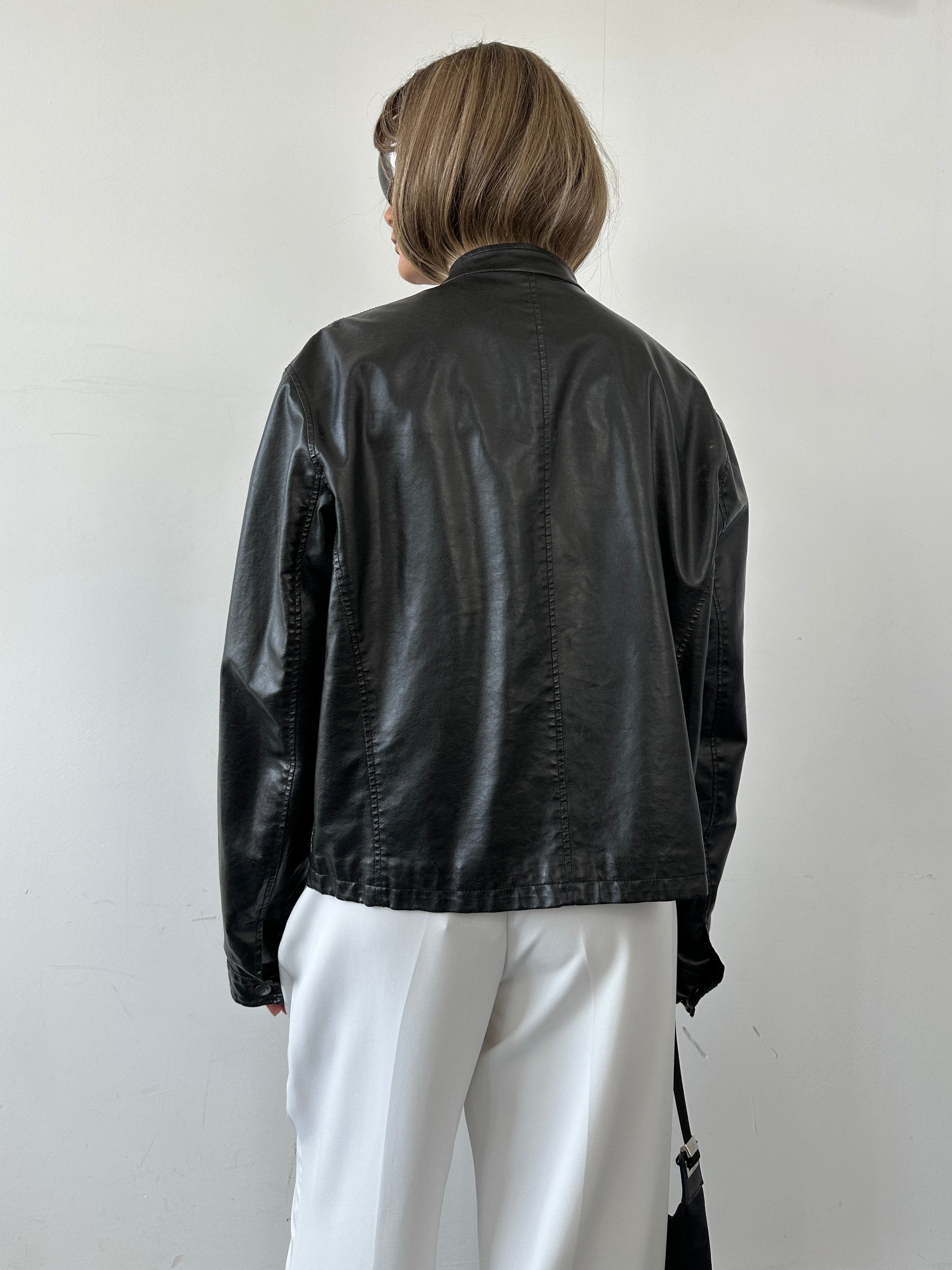Armani Jeans faux leather biker jacket in size M, featuring classic lapel and zipper details, black with stylish stitching.