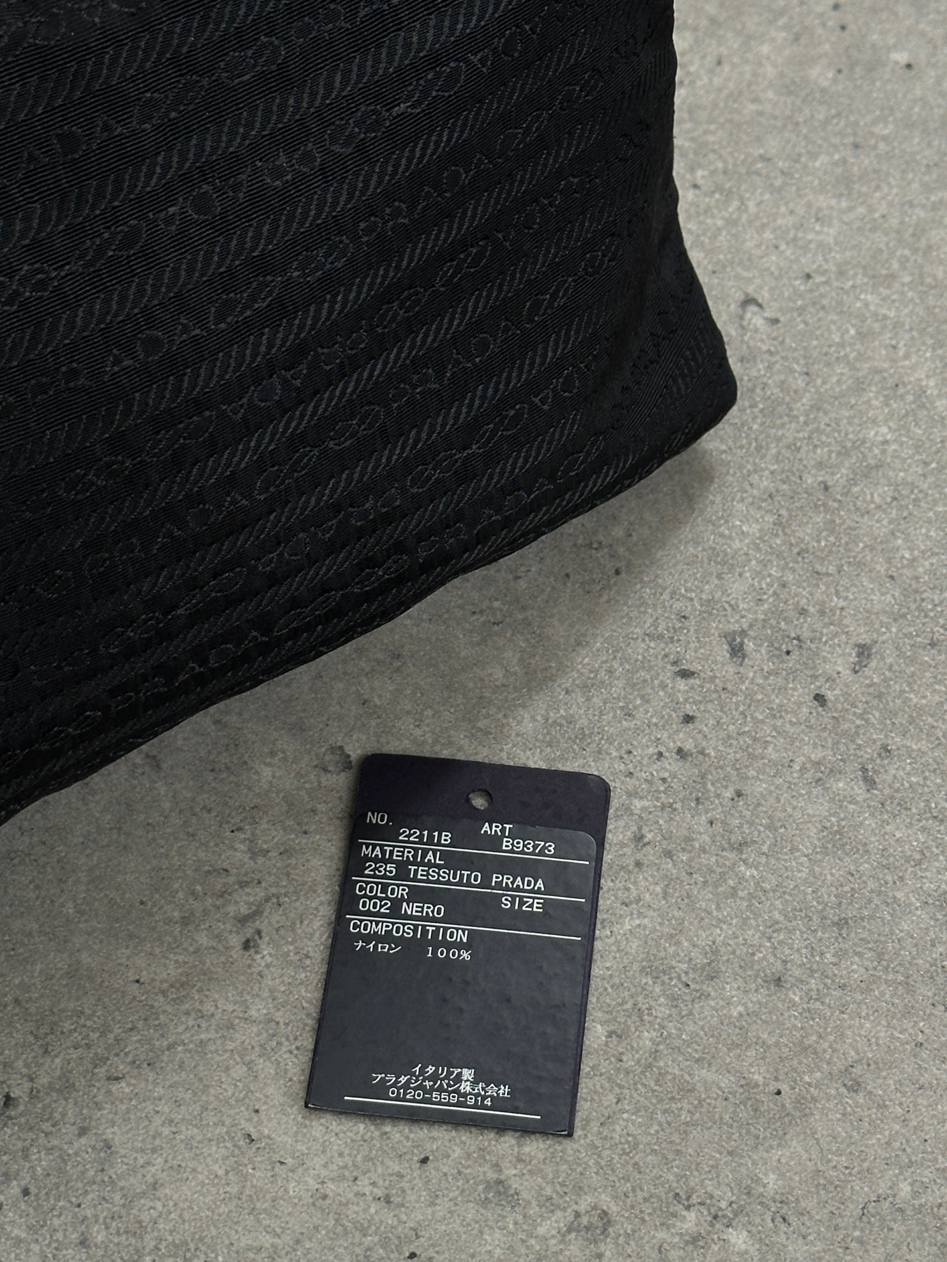 Prada Nylon Tessuto Monogram Crossbody Bag with adjustable strap and signature Prada logo detail.