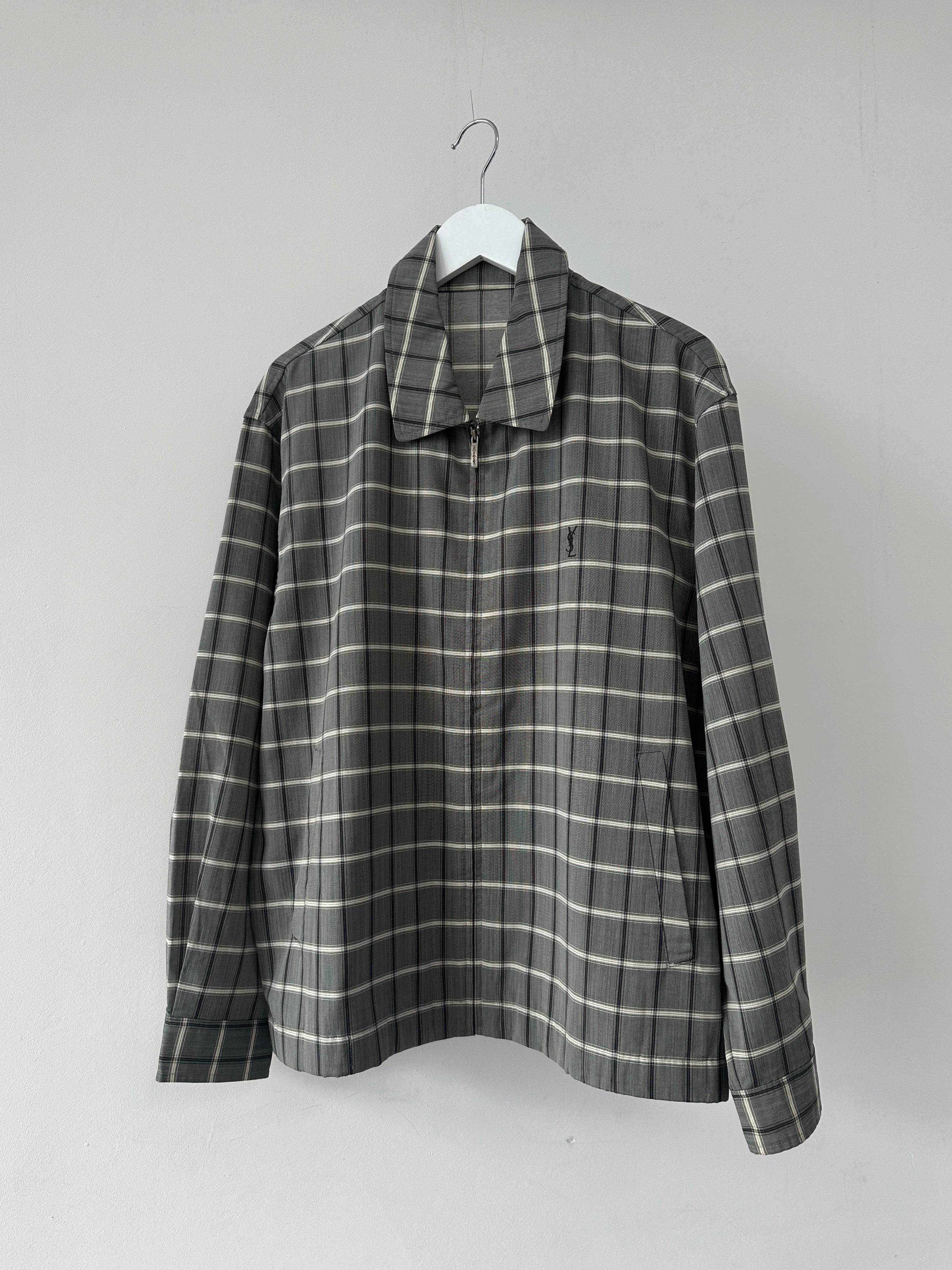 Yves Saint Laurent Pour Homme check logo bomber jacket in black with ribbed cuffs and collar, front zipper closure, full view.