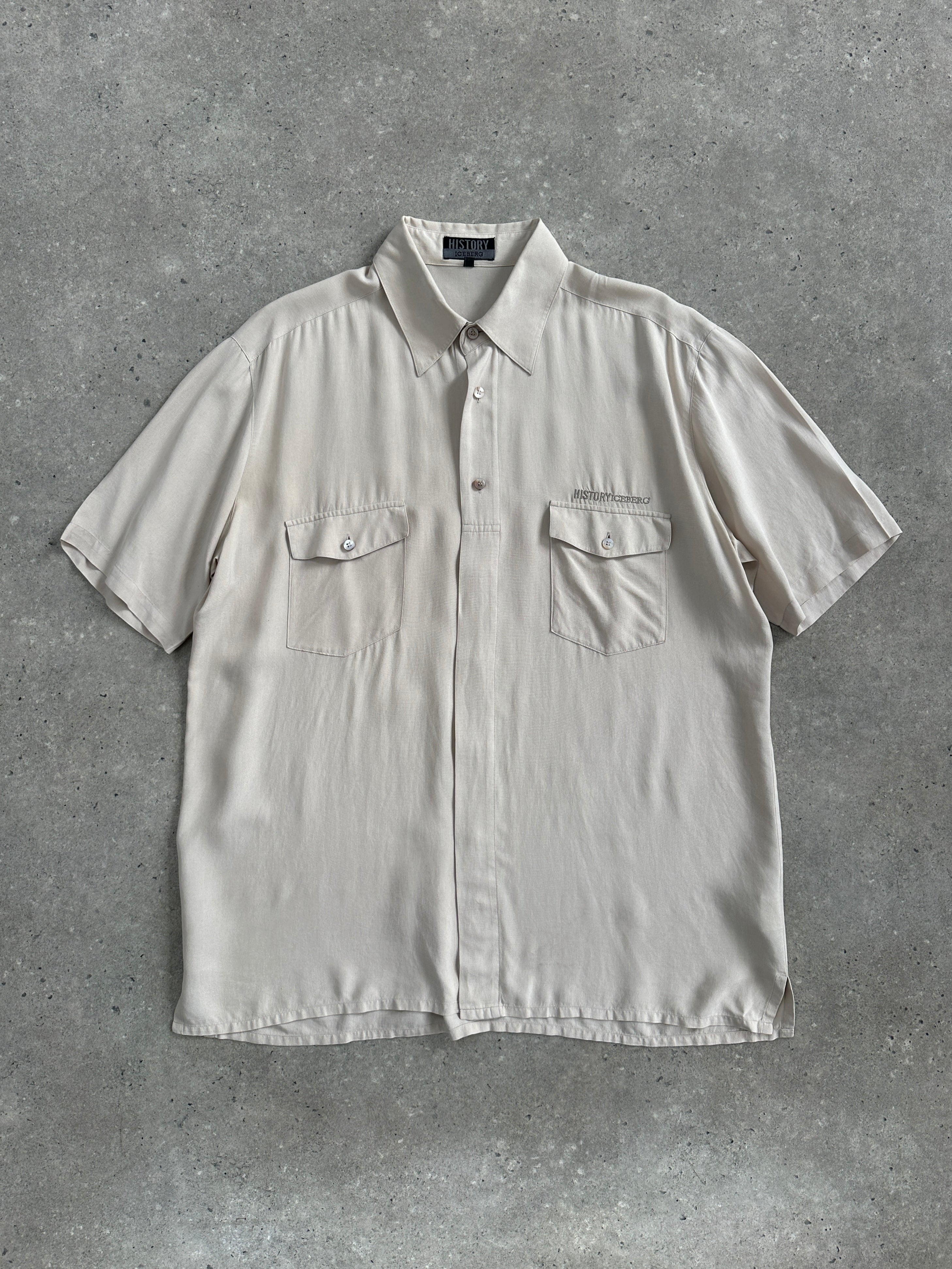 Iceberg 90s pure silk short sleeve shirt in XL, featuring a sleek design and smooth fabric, displayed on a hanger.