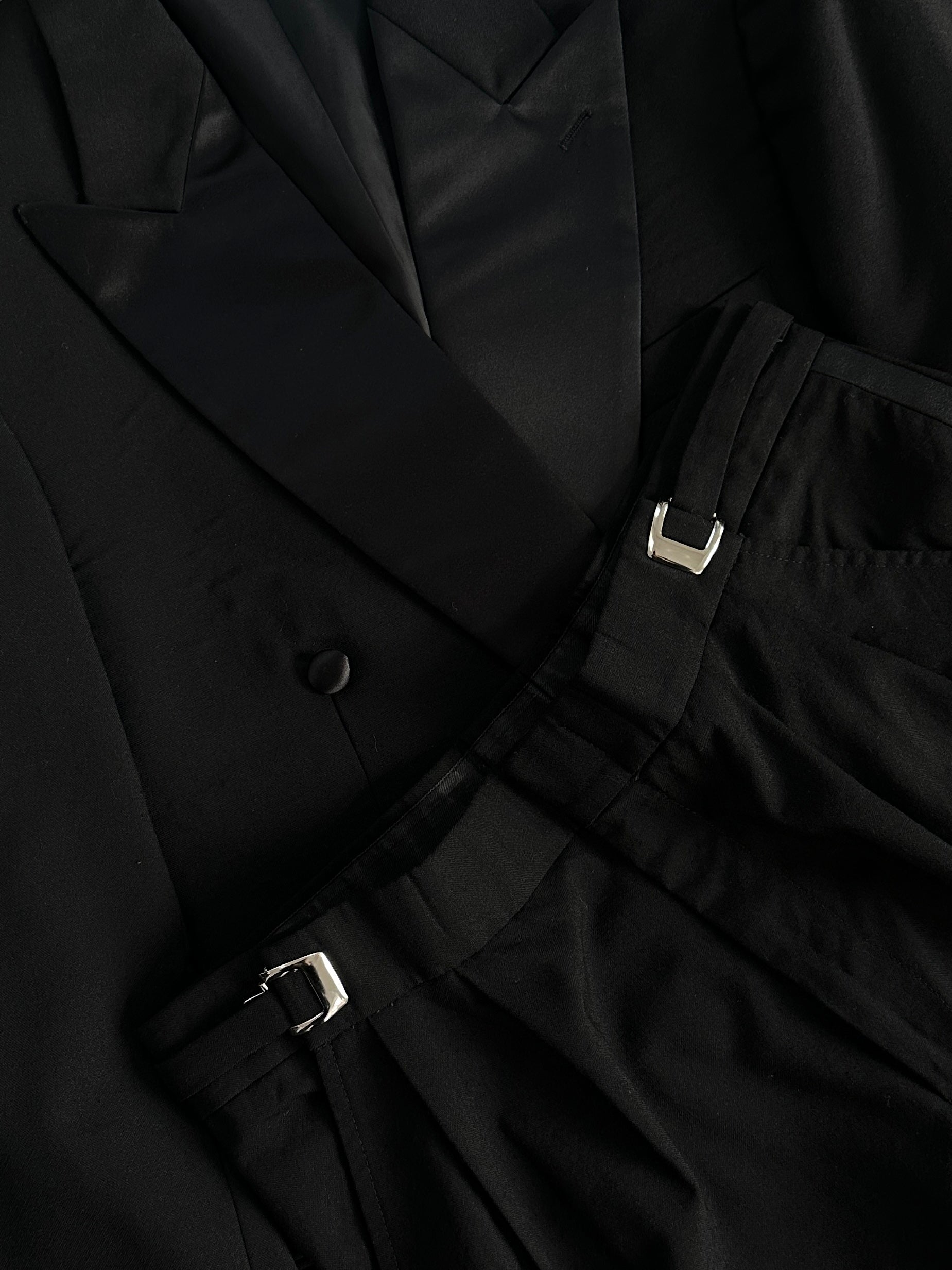 Vintage brand vintage tuxedo jumpsuit in double-breasted pure wool, size 38R/W26-32, shown in full view with lapels and tailored fit.