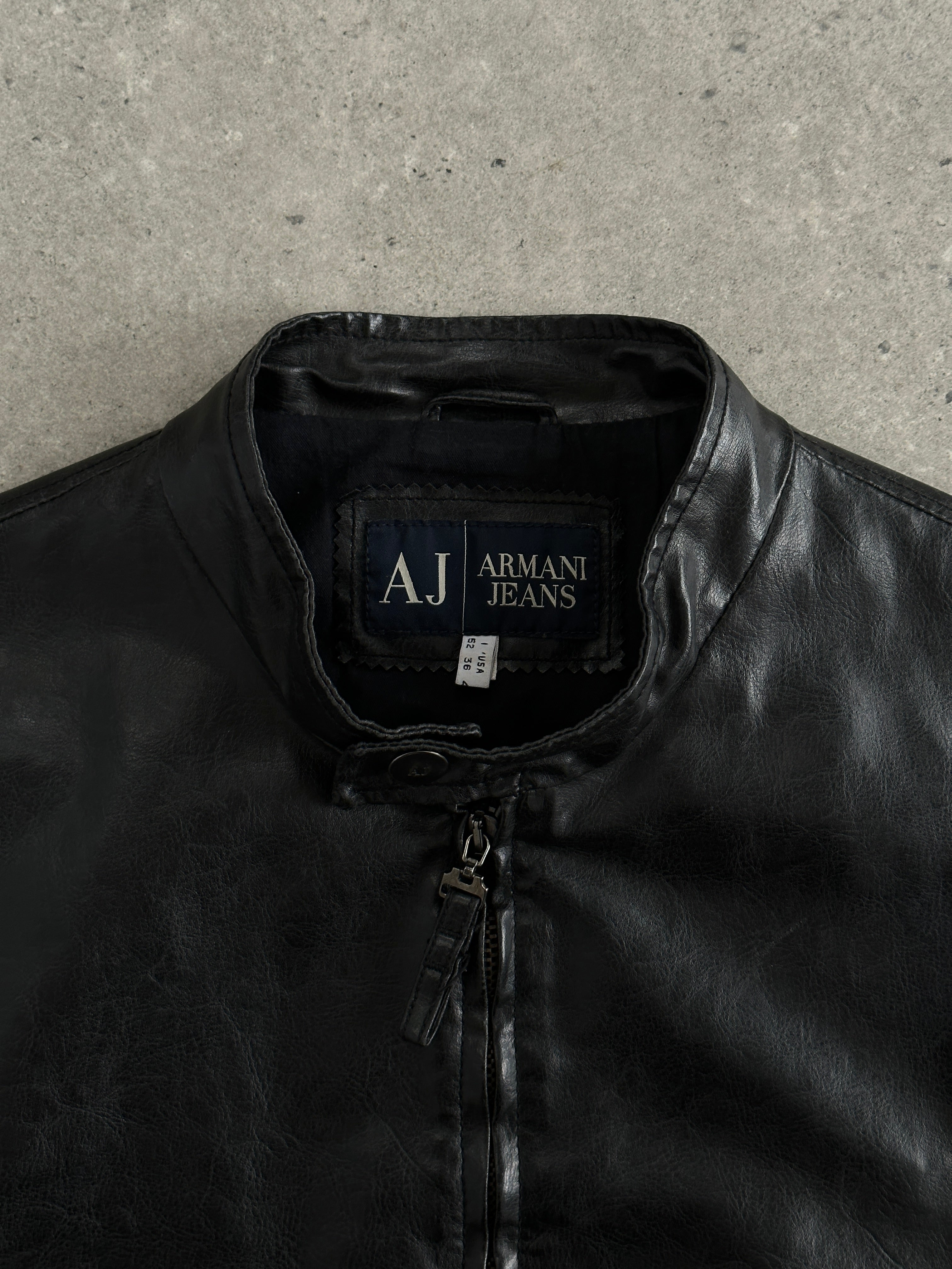 Armani Jeans faux leather biker jacket in size M, featuring classic motorcycle style with silver hardware and fitted design.