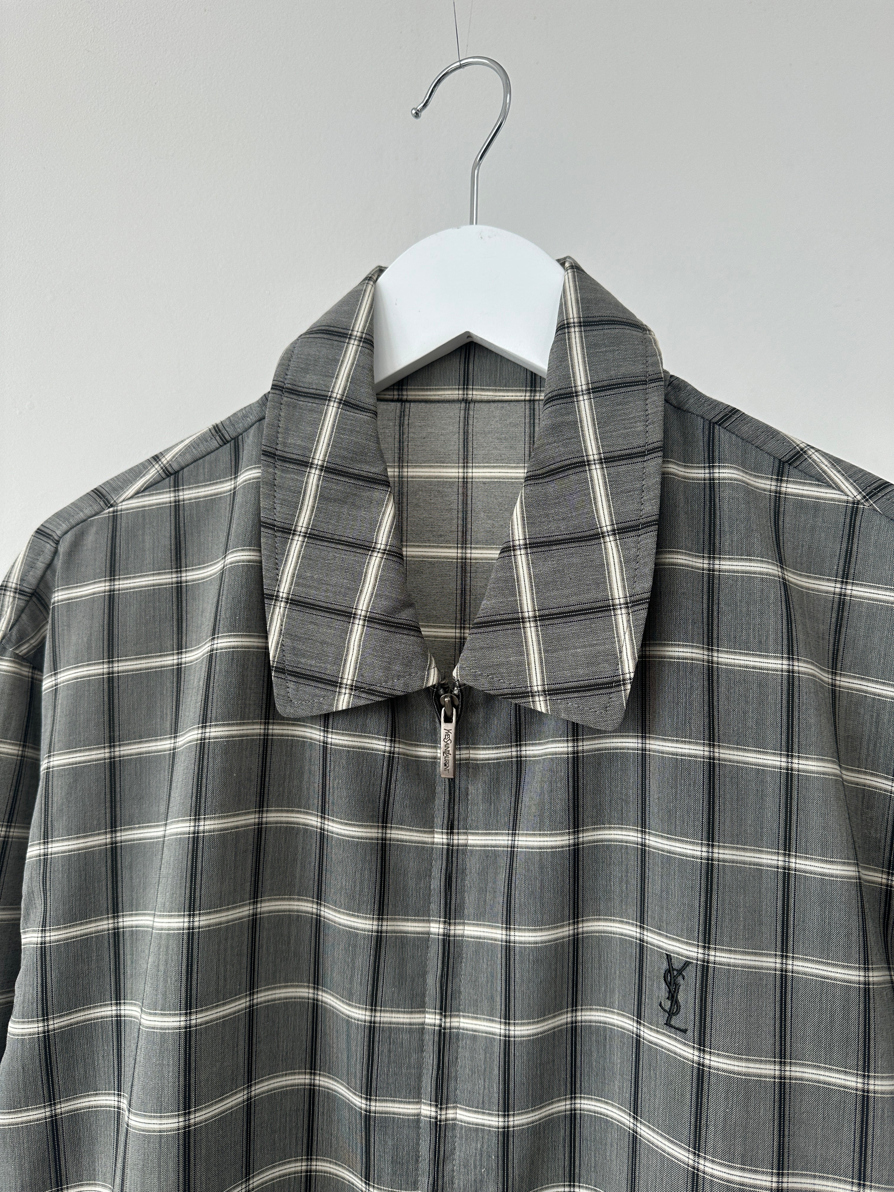 Yves Saint Laurent Pour Homme check logo bomber jacket in black and gray, featuring a logo patch on the front.