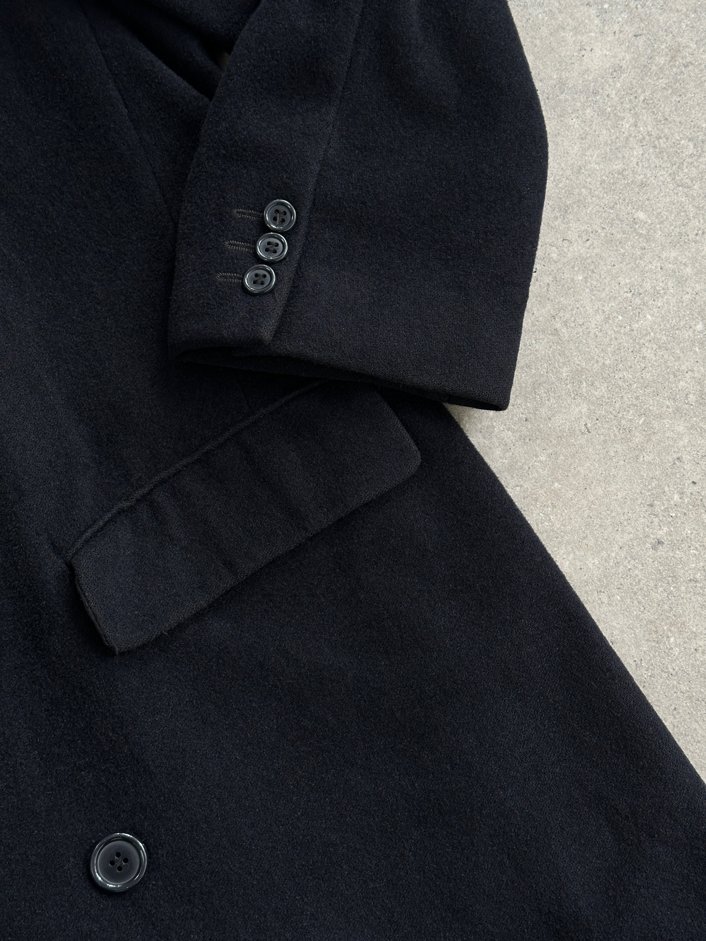 Pierre Cardin wool cashmere double-breasted coat in size L/XL, shown hanging with classic lapels and tailored fit.