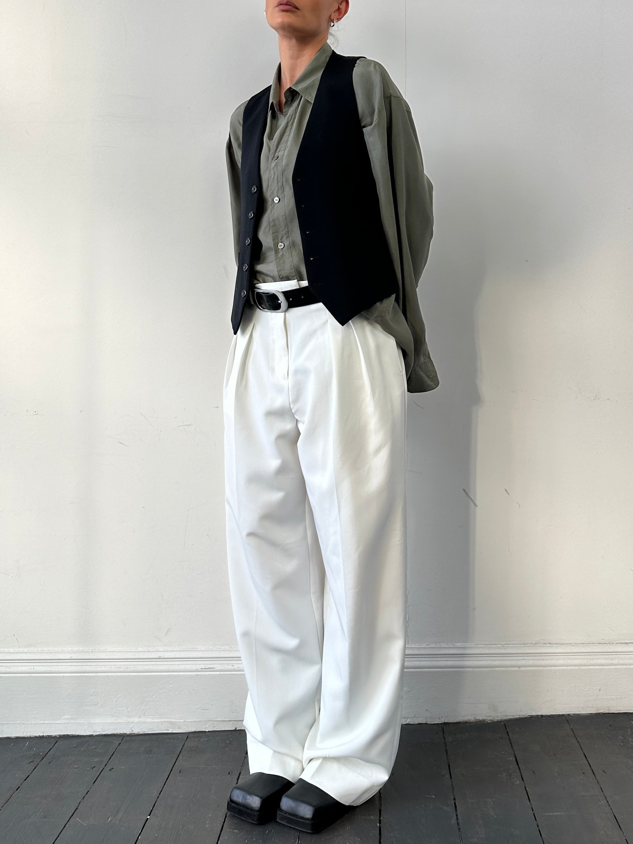 Vintage Pure Wool Tailored Waistcoat in size S, classic tailored design with lapel collar and button closure, displayed on a hanger.