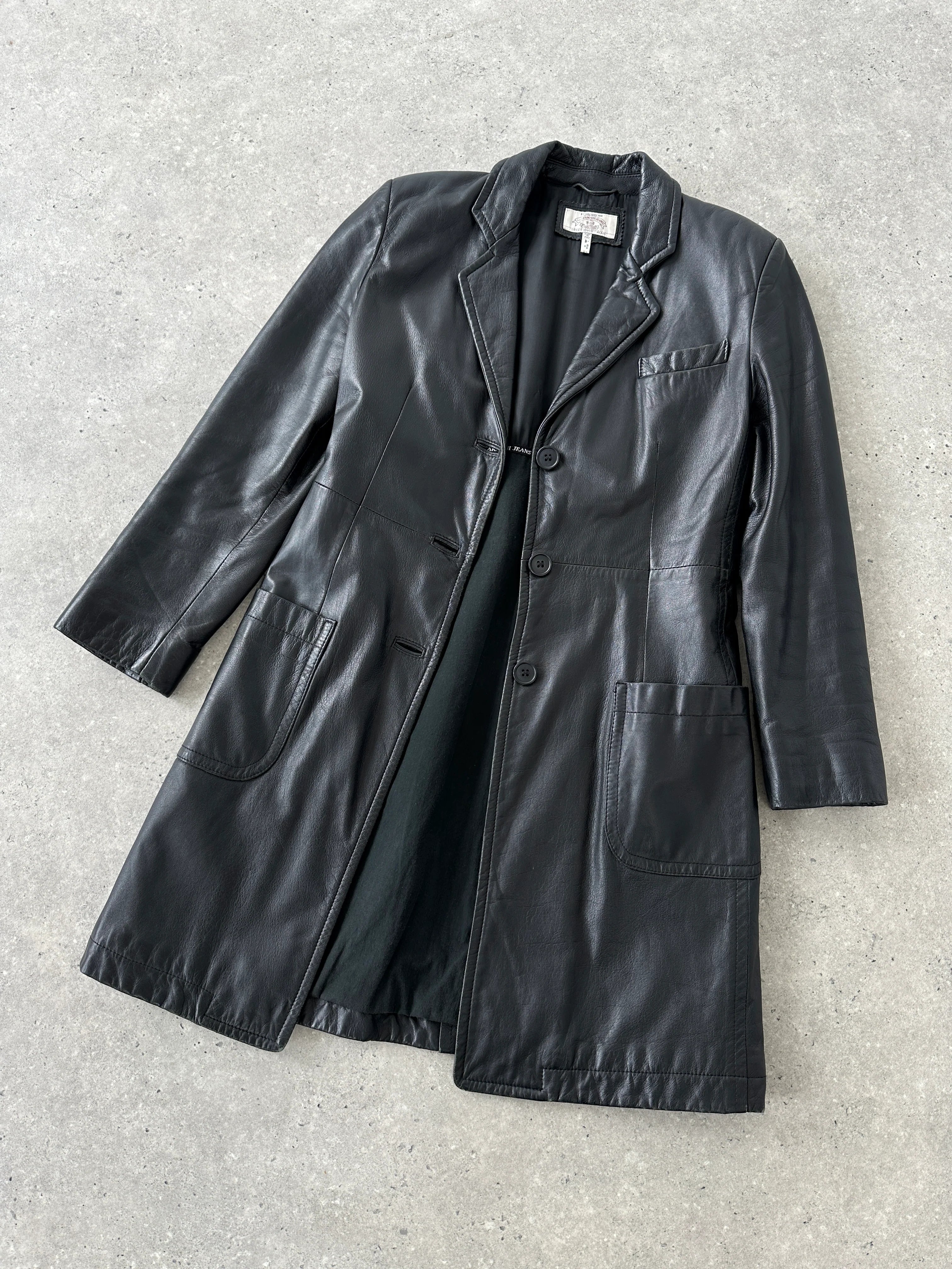 Armani leather trench coat in XS displayed on a hanger, featuring classic design and smooth leather material.
