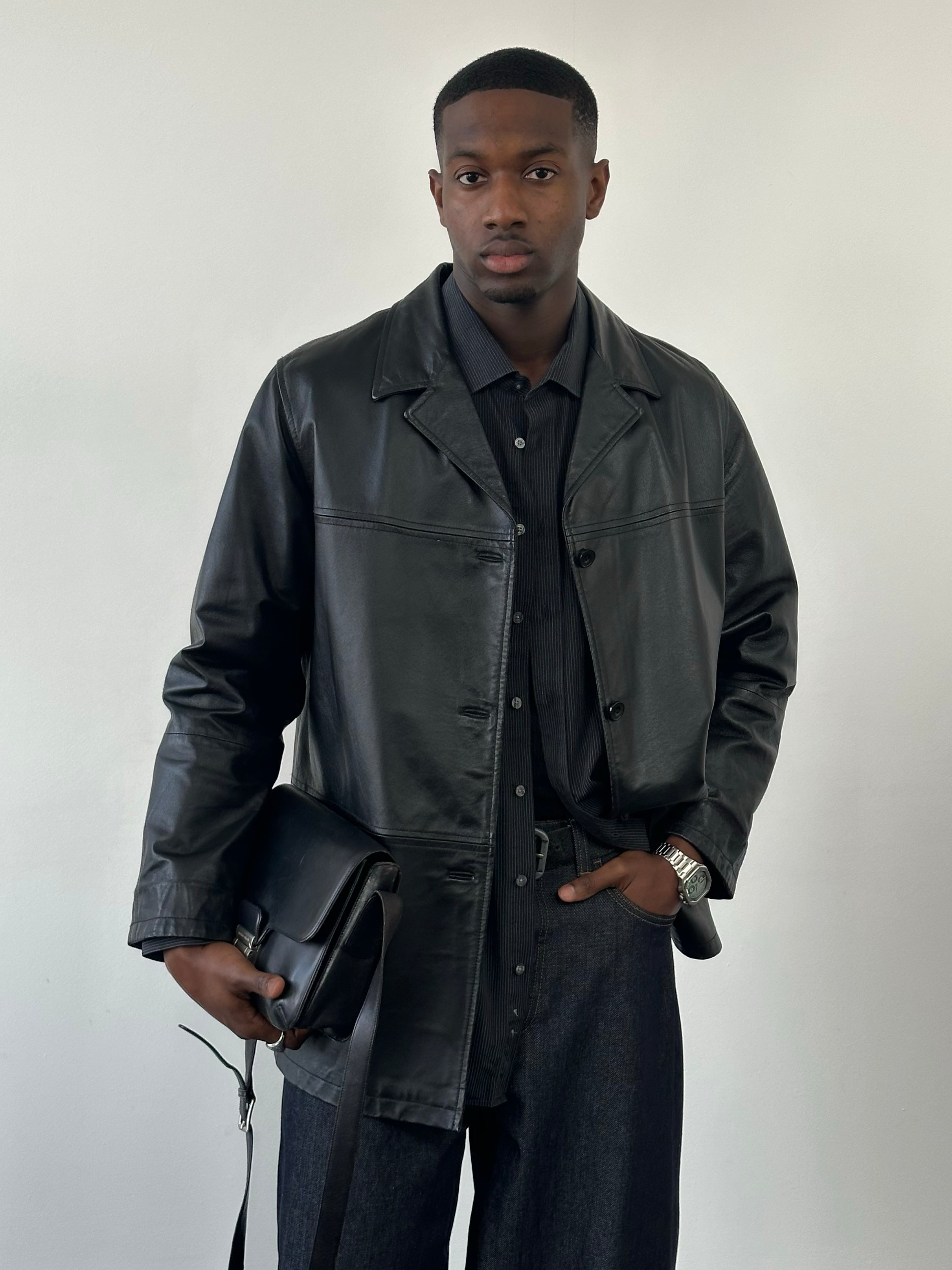 Vintage Italian 1990s leather jacket, single-breasted design, size large, featuring classic leather material and timeless style.