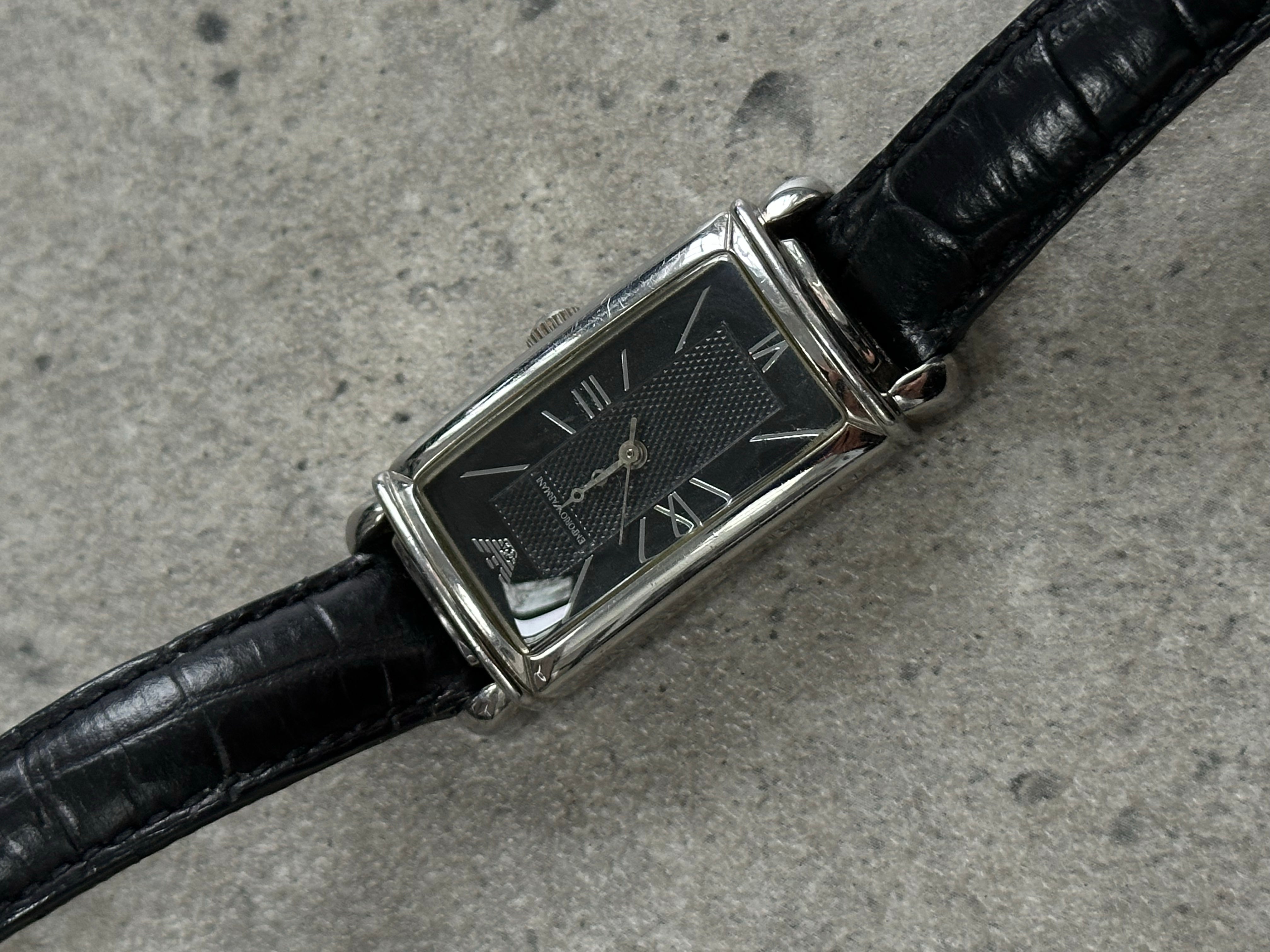 Emporio Armani 2000s leather watch with round dial and black leather strap, showcasing elegant design and classic style.