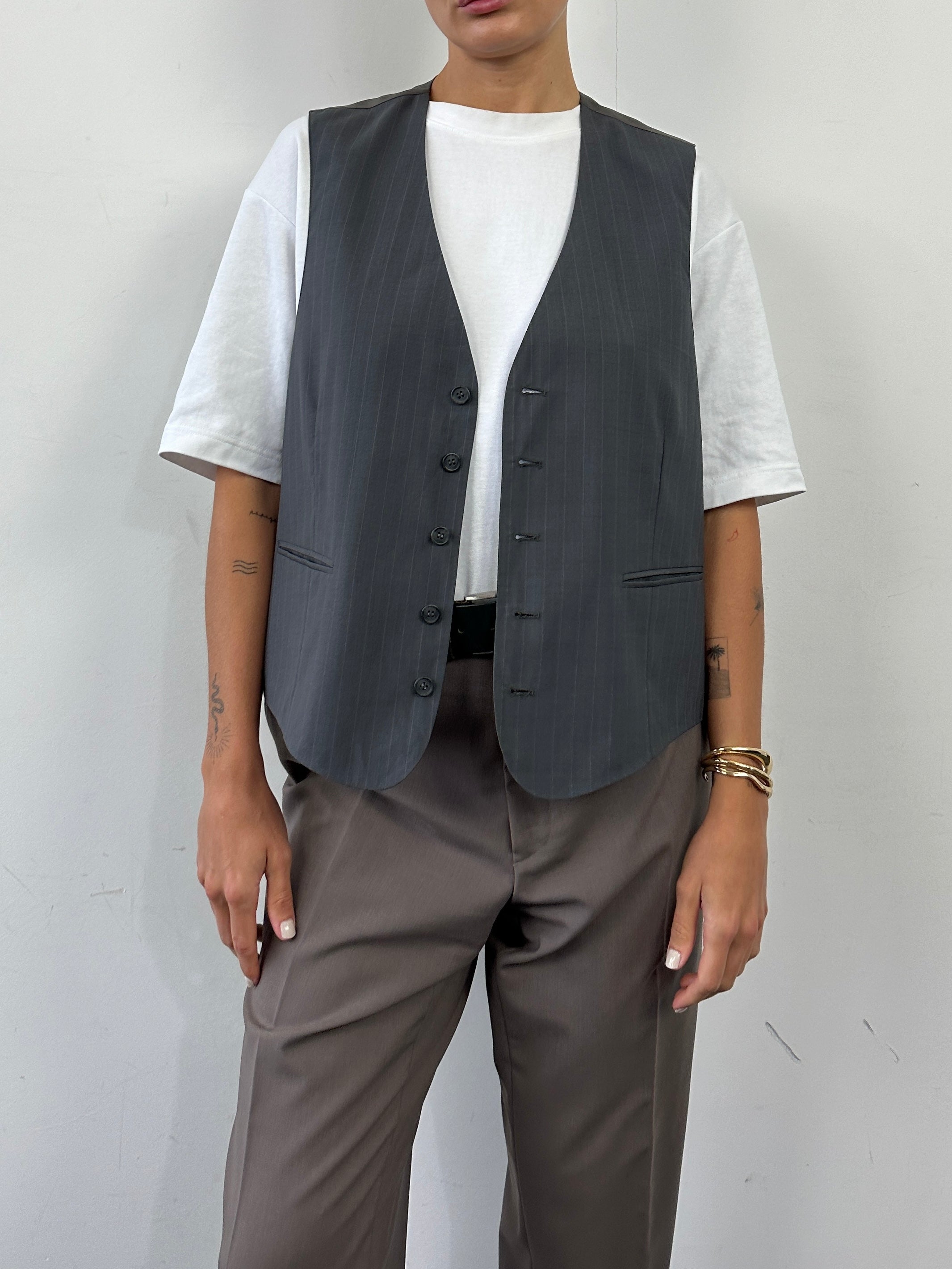 Vintage 1990s striped tailored waistcoat in size large, featuring classic design and vibrant colors, from the Vintage brand.