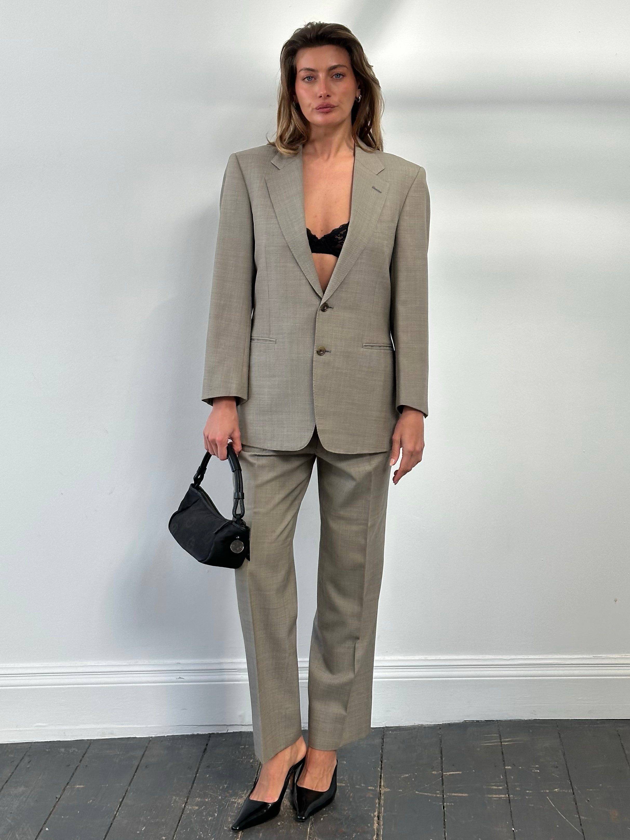 Burberry 1990s pure wool single-breasted suit in classic design, displayed on a mannequin with a neutral background.