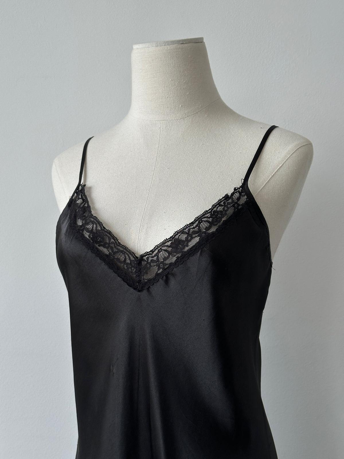 Vintage 1990s satin lace midi slip dress in size M, featuring elegant lace details and a smooth satin finish.
