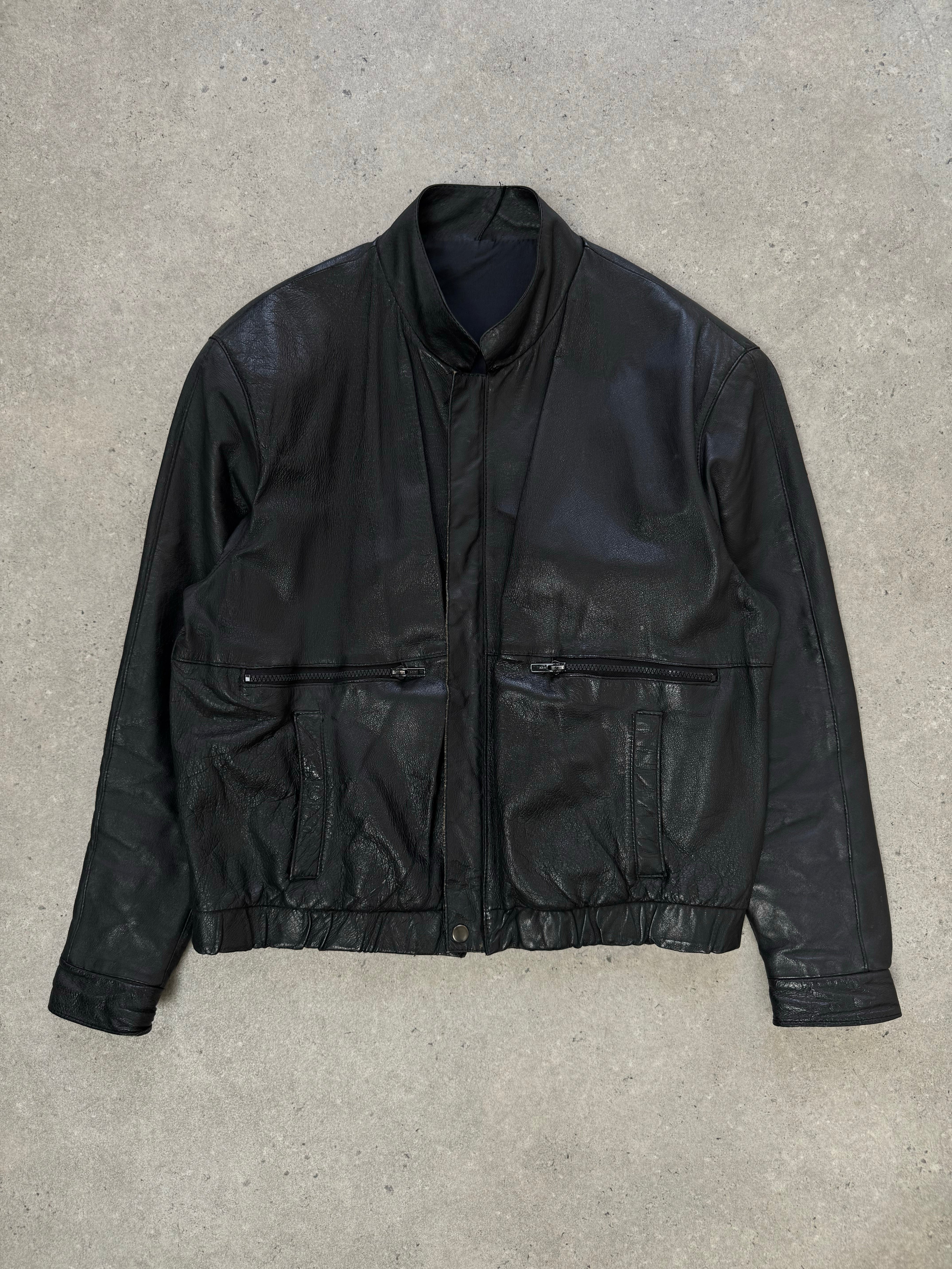 Vintage 1990s minimal leather jacket in size M, showcasing classic design and smooth leather texture.