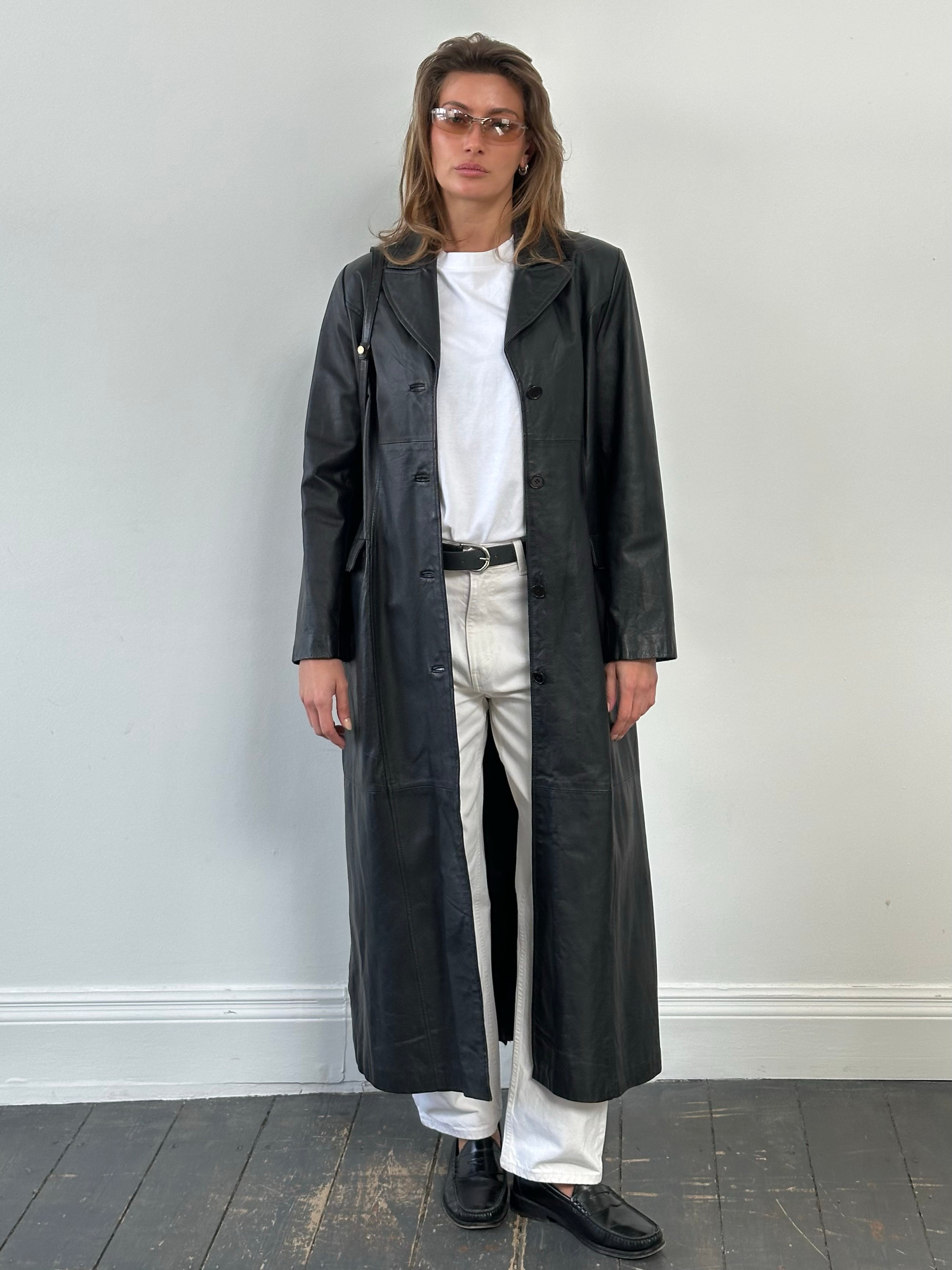 Vintage 1980s leather trench coat, floor length, size M, featuring classic design and rich leather texture.