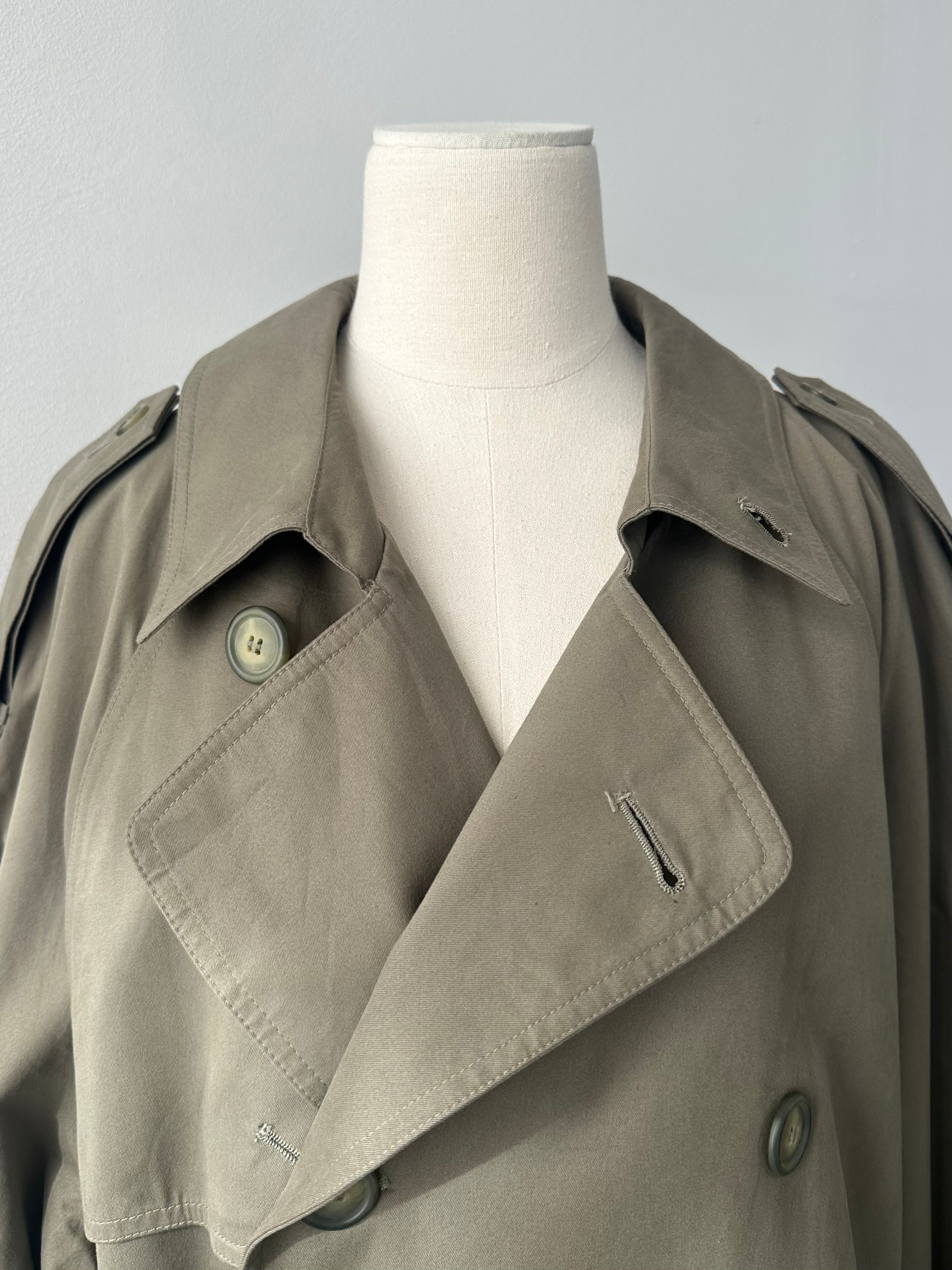 London Fog 1980s cotton belted trench coat in XL, showing the classic beige coat with double-breasted buttons and waist belt.