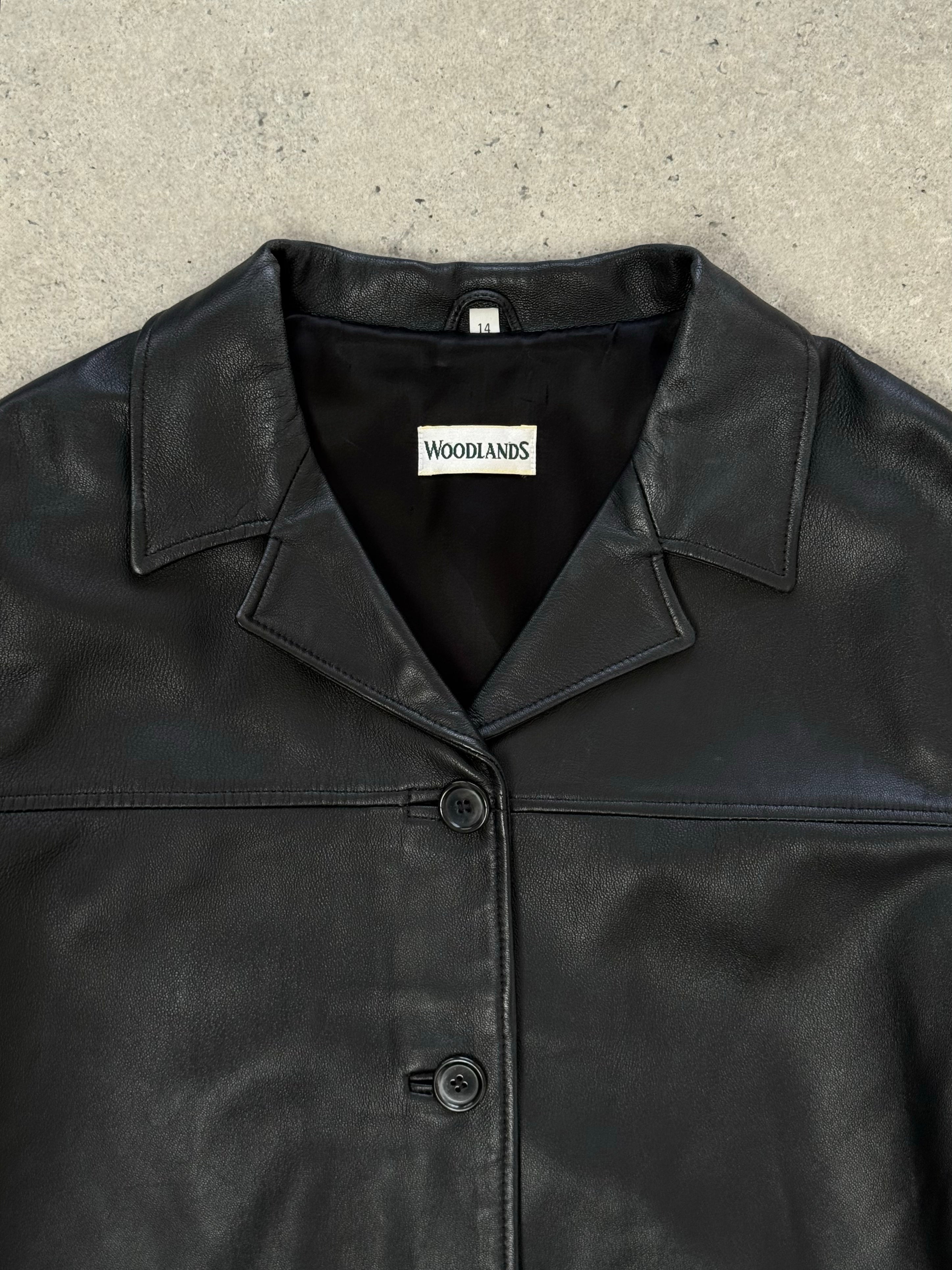 Vintage 1990s boxy leather jacket in size M, featuring classic design and genuine leather material, displayed on a neutral background.