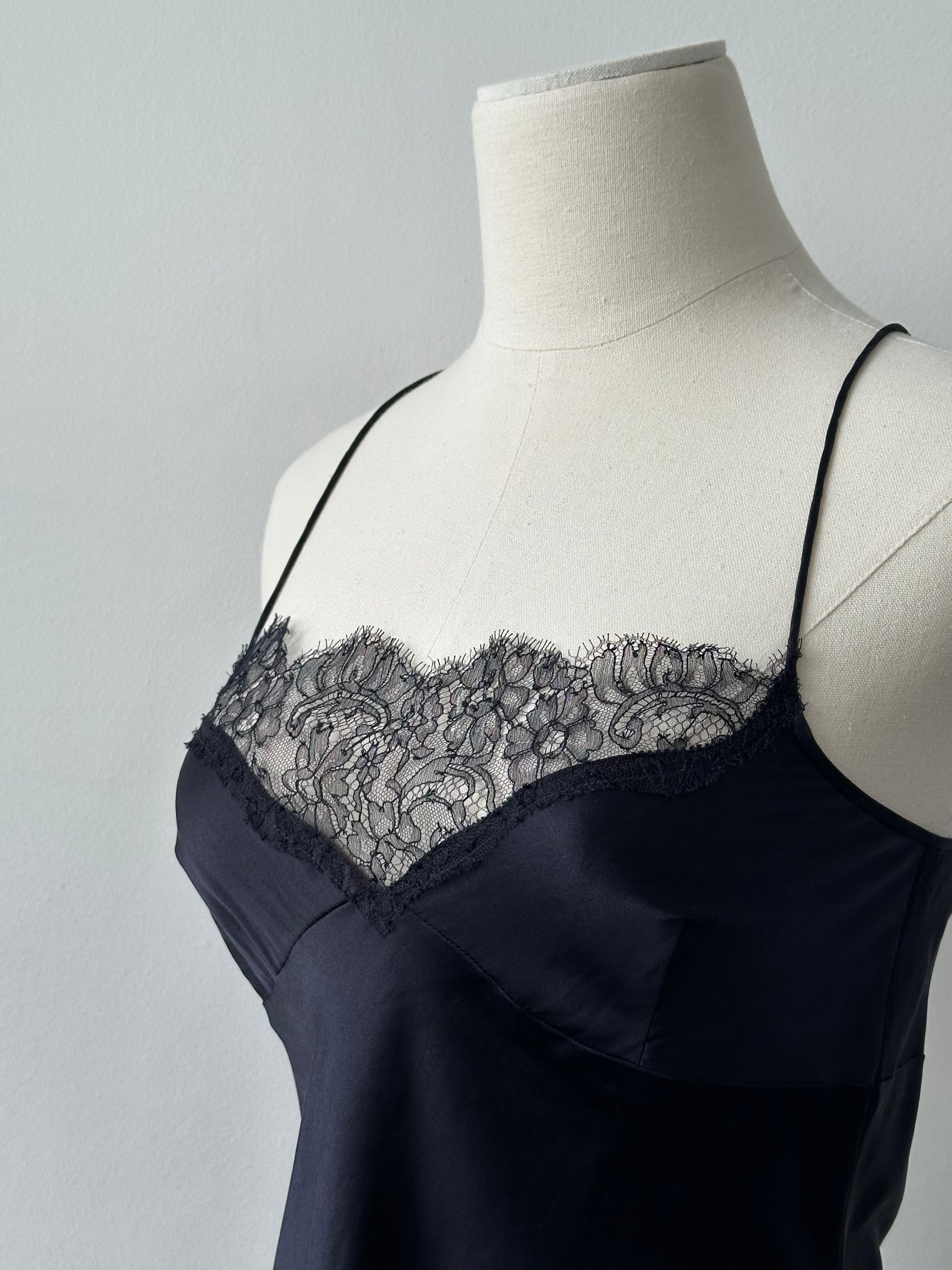 DKNY 2000s silk lace cami top in XS, featuring delicate lace details and a soft, silky fabric, styled on a hanger.