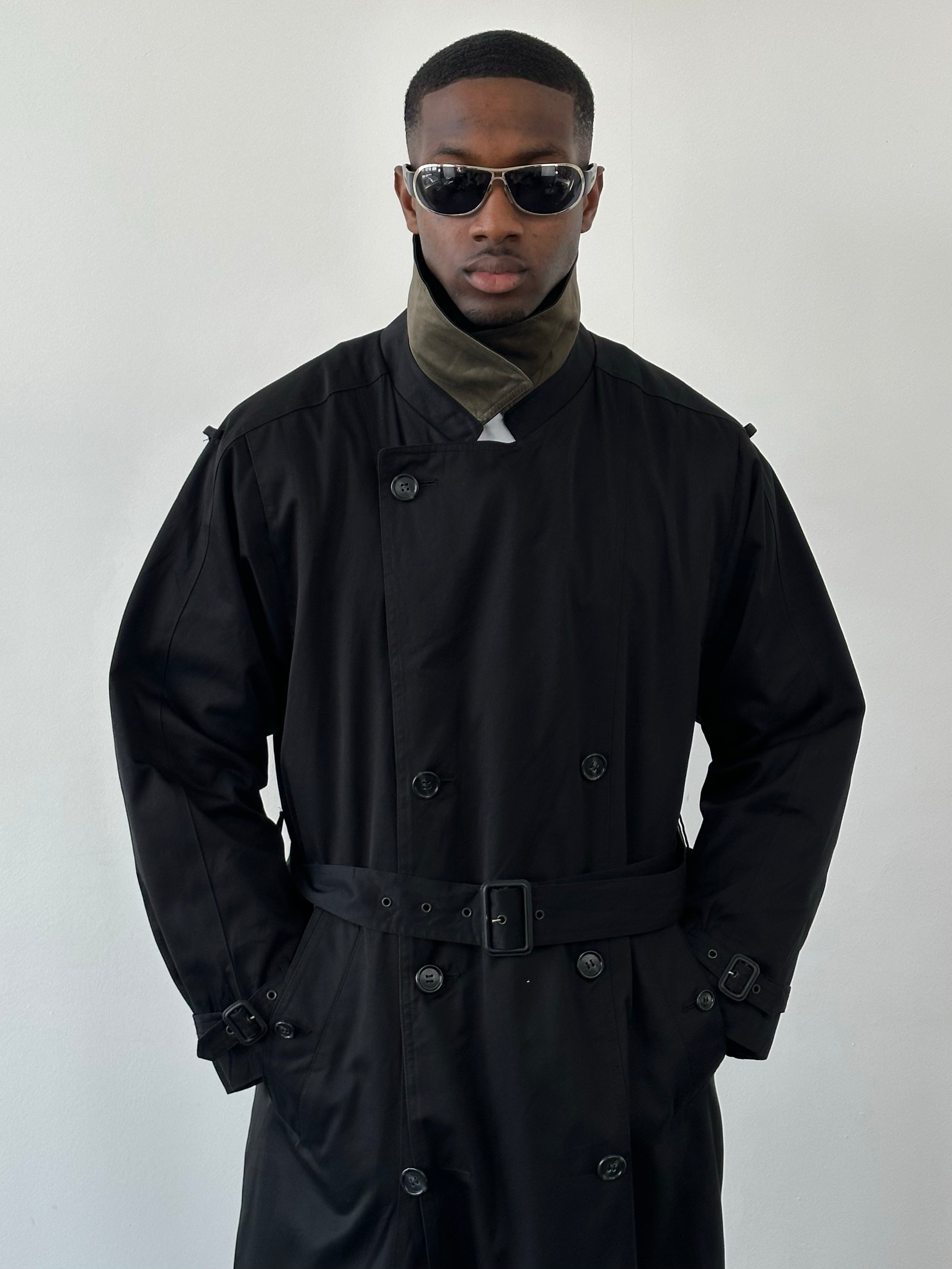 London Fog Towne 1990s double-breasted belted trench coat, beige color, shown on a model with classic collar and waist belt.