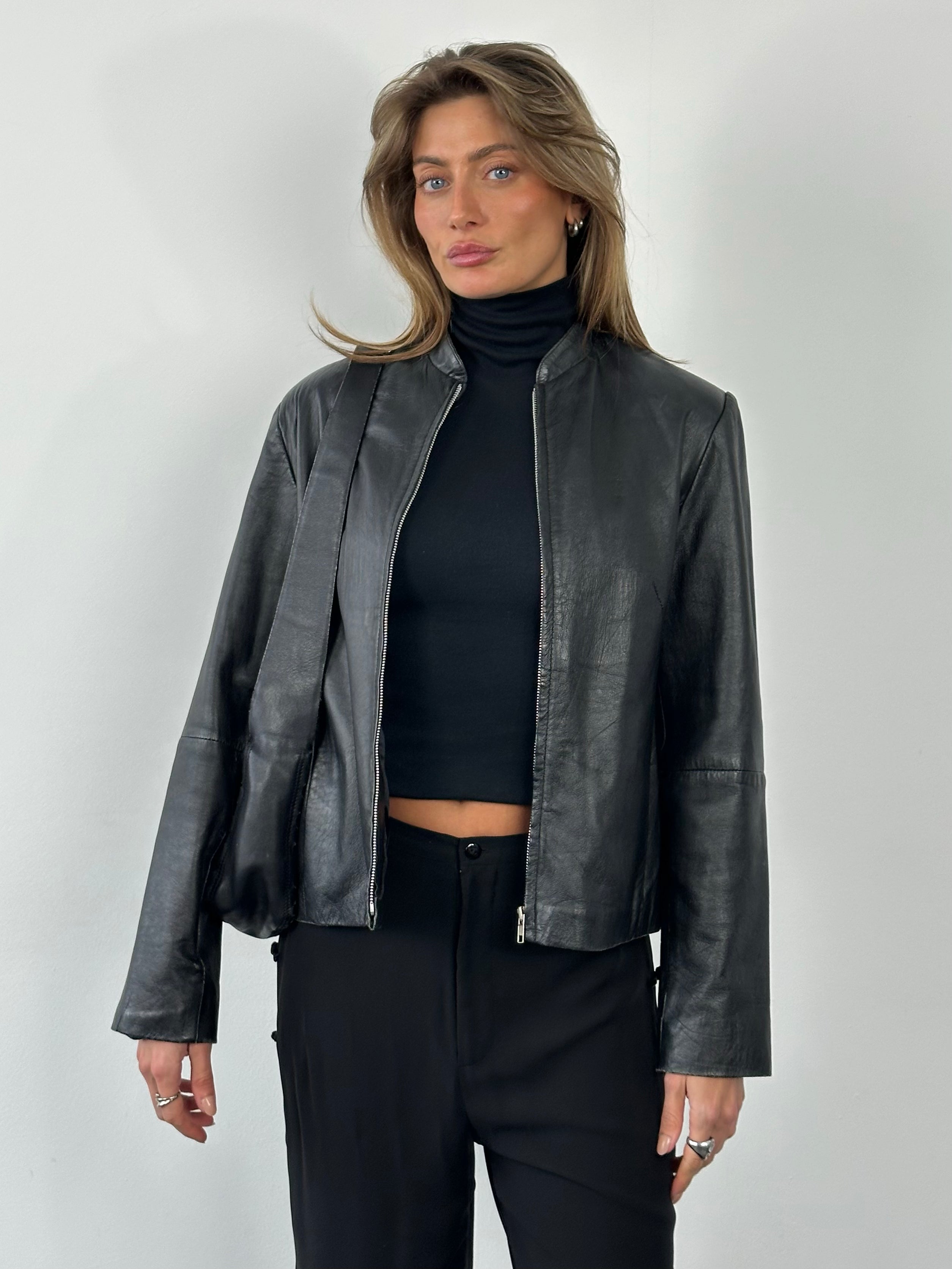 Vintage 1990s leather high-neck jacket in size small, featuring classic design and rich brown leather from Vintage brand.