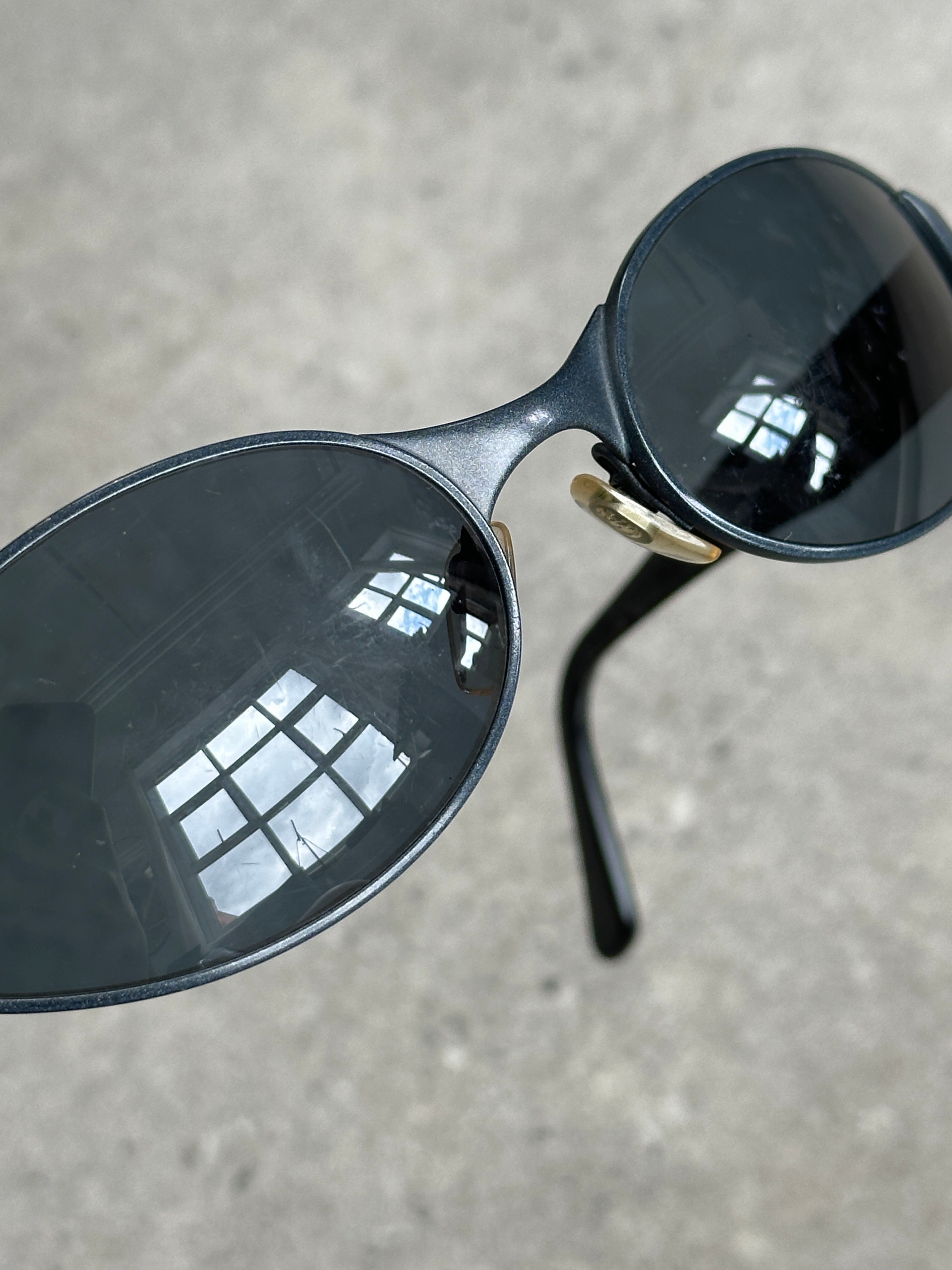 Emporio Armani 1990s oval logo sunglasses with dark tinted lenses and sleek black frame, stylish eyewear for a vintage-inspired look