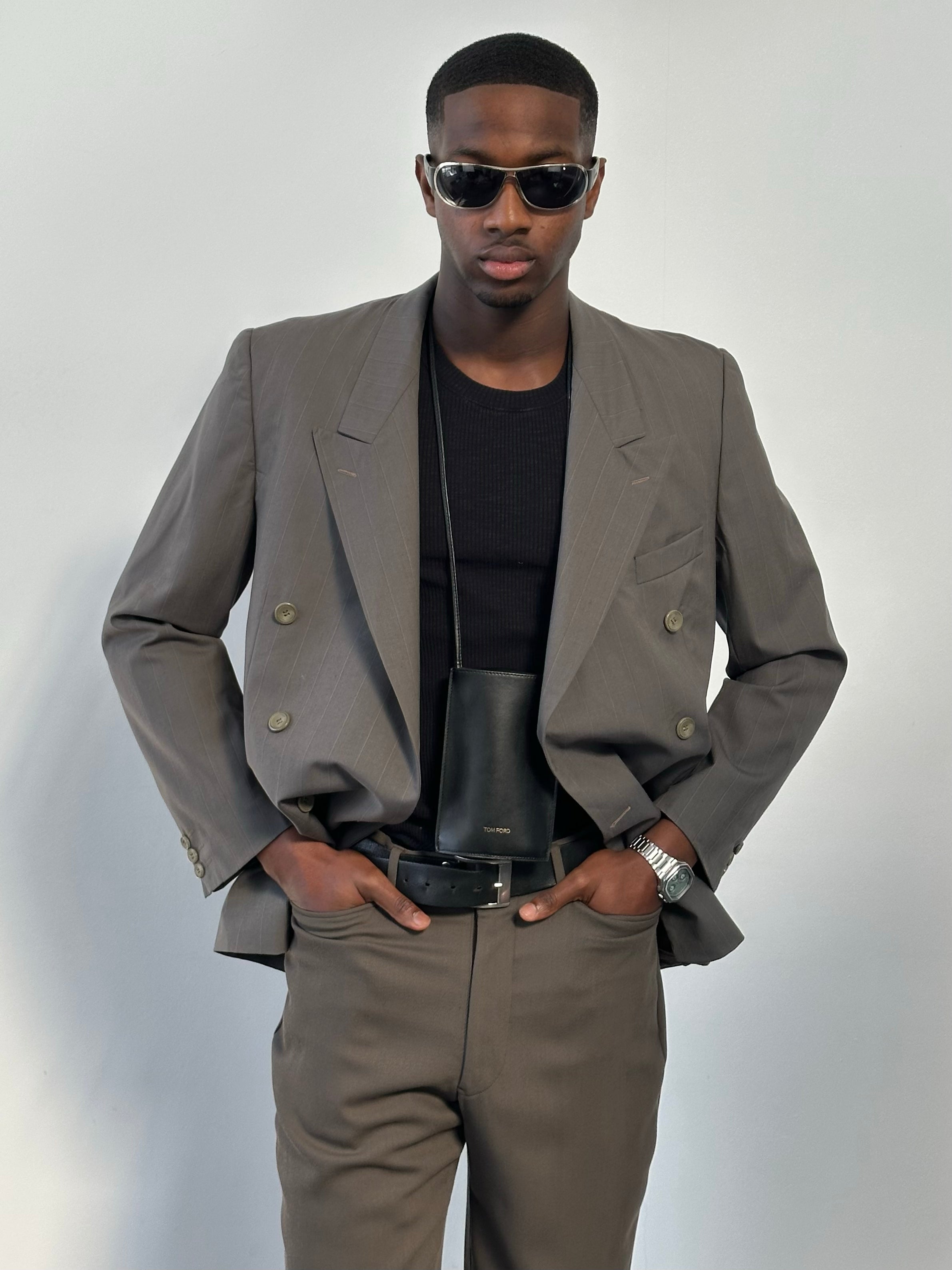 Yves Saint Laurent 1990s double-breasted wool blazer in classic black, tailored fit, with wide lapels and button closure.