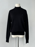 Yves Saint Laurent 1990s wool high neck jumper in size M, featuring a cozy knit design and classic silhouette.